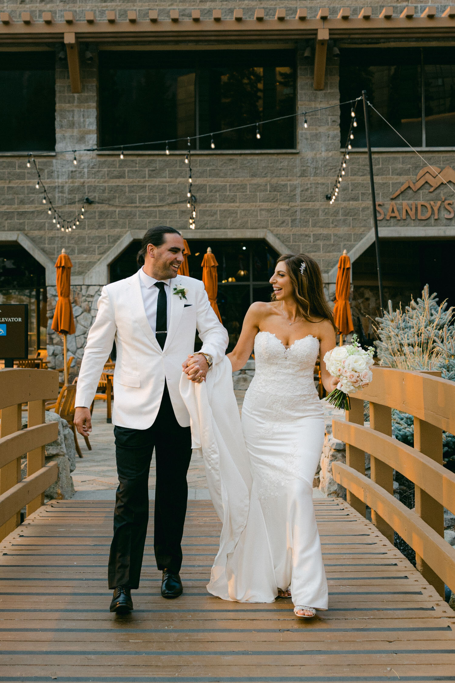 Palisades wedding, photo of couple walking and smiling at each other 