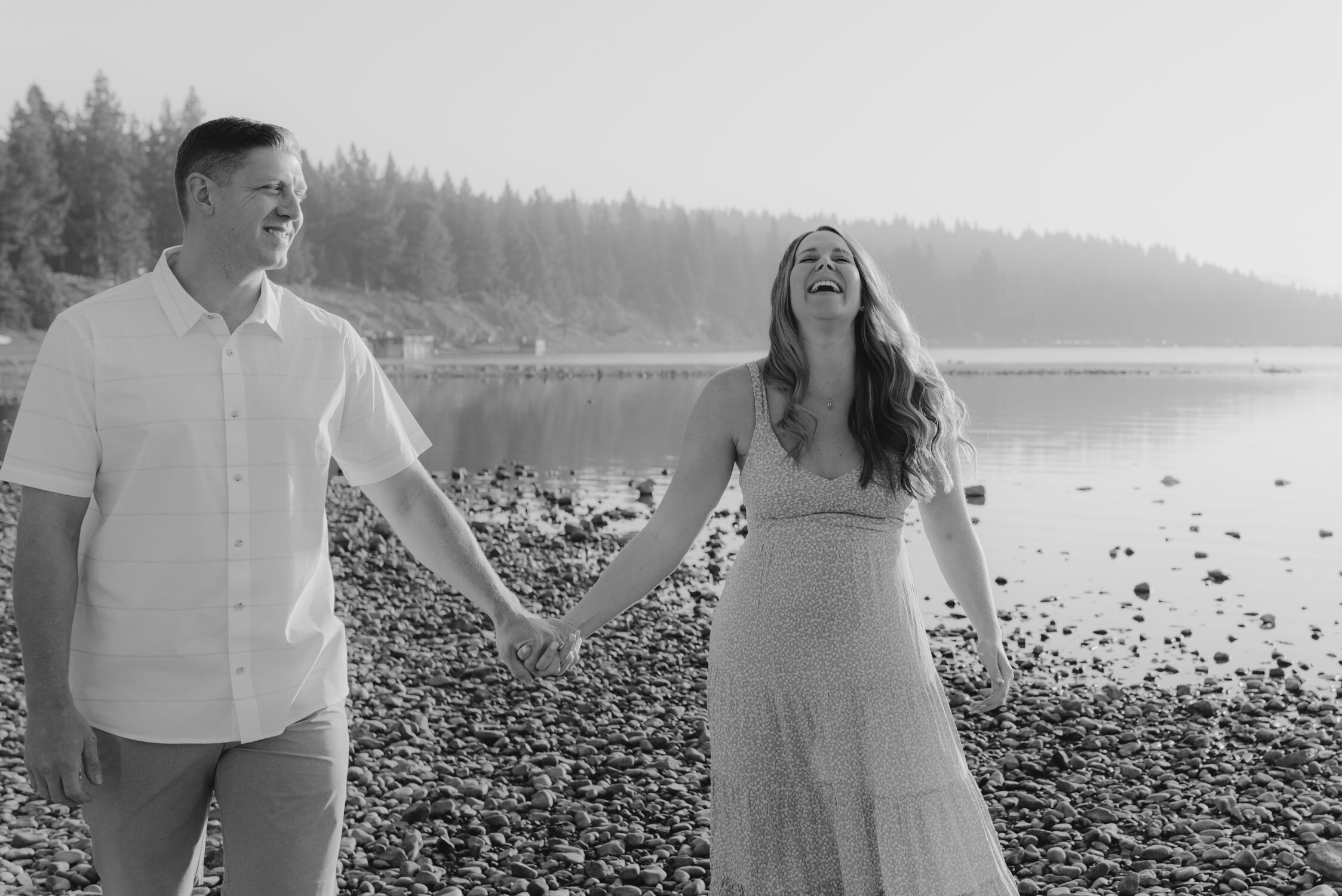 Lake Tahoe Maternity Session, photo of couple holding hands and laughing 
