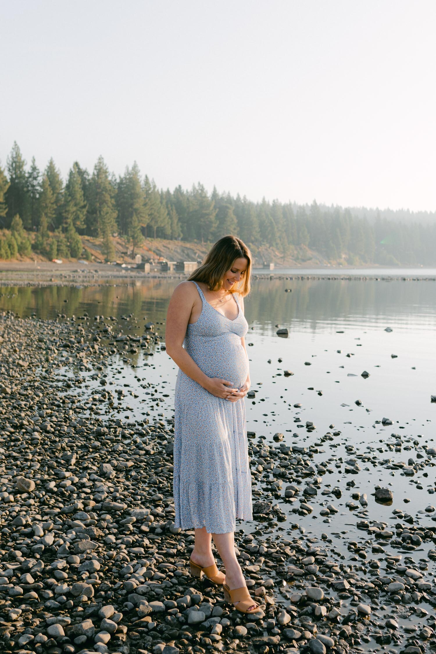 Lake Tahoe Maternity Session, photo of mom-to-be holding her belly during a sunrise shoot