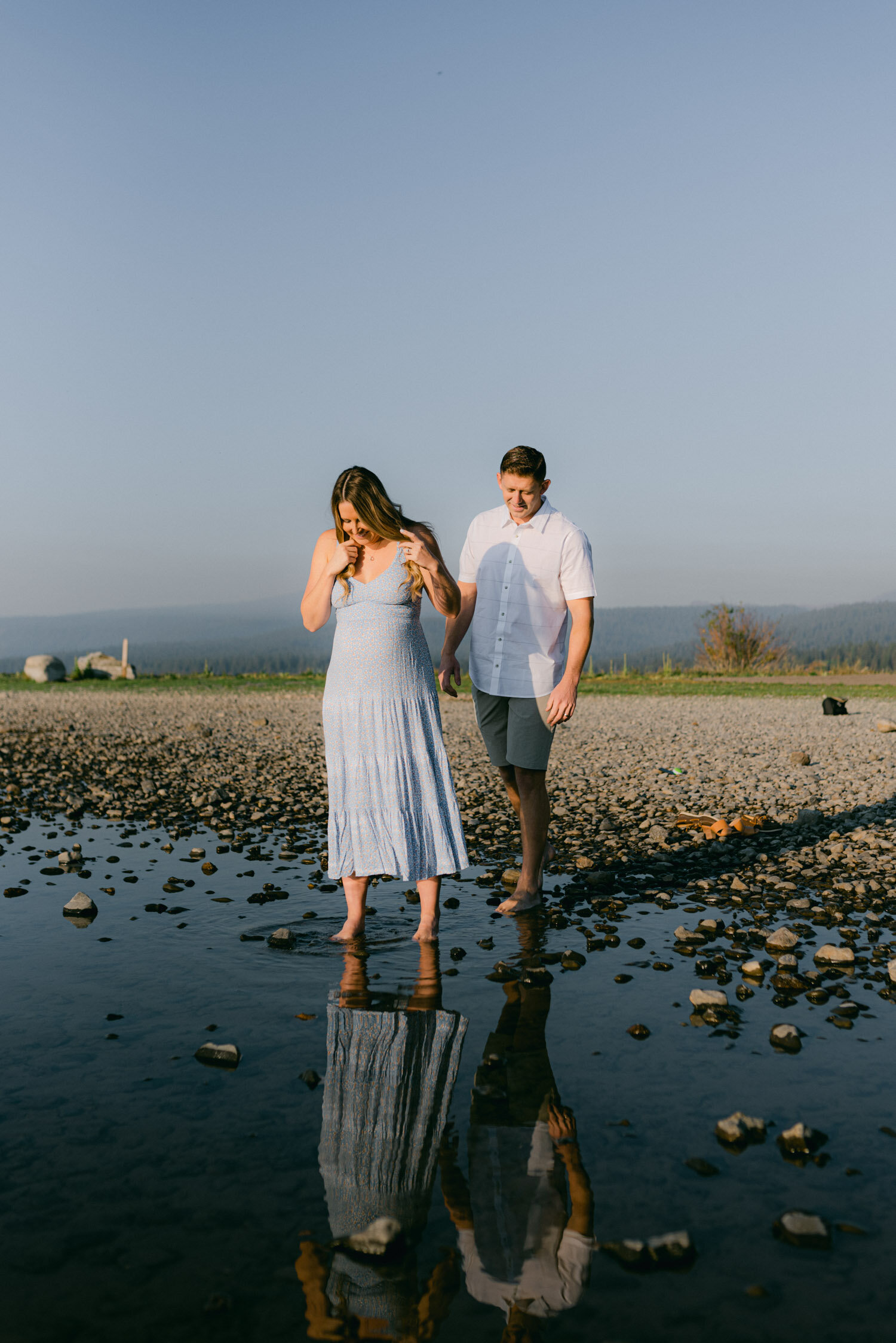 Lake Tahoe Maternity Session, photo of couple walking in the shallow water