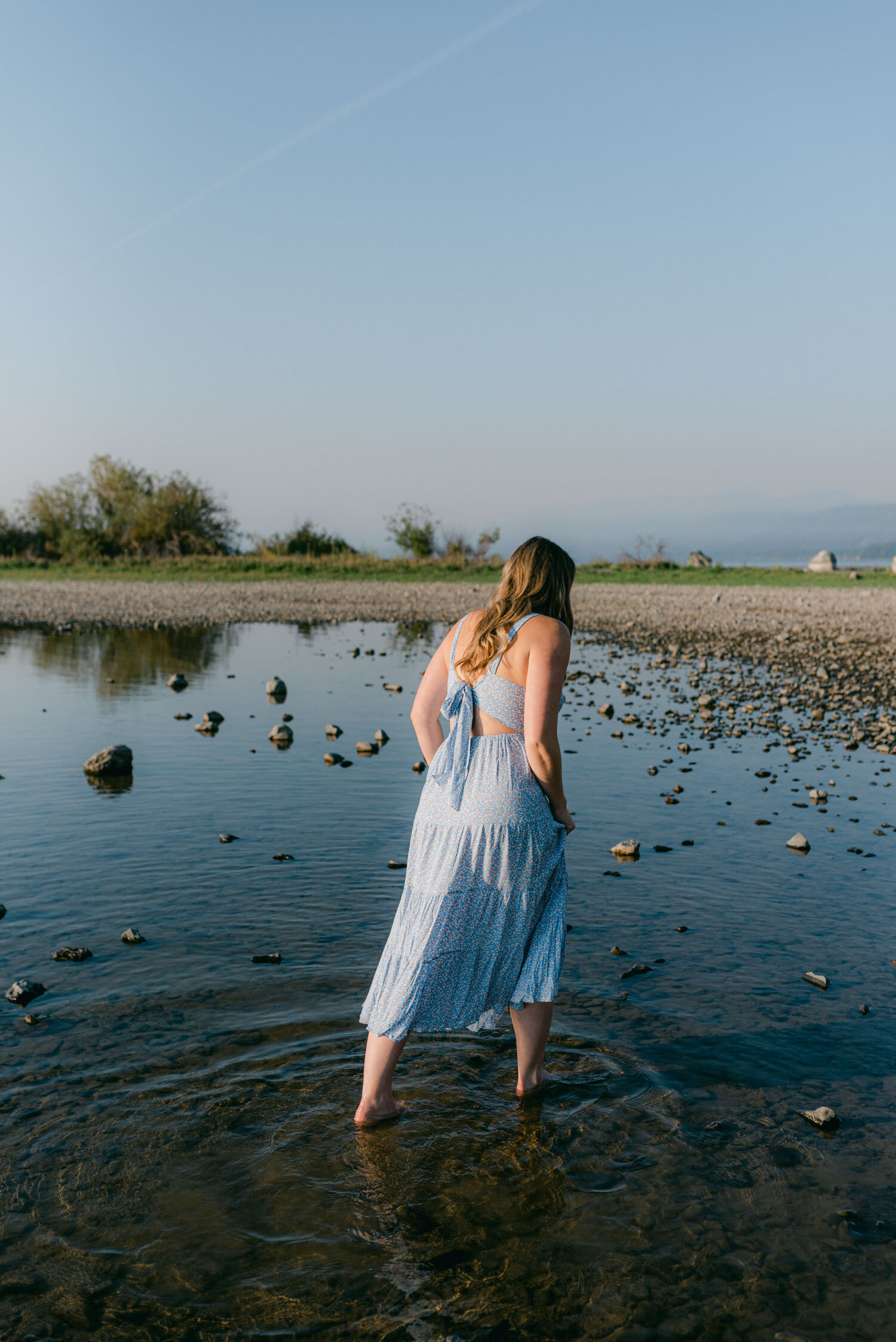 Lake Tahoe Maternity Session, photo of mom walking in the shallow lake tahoe water