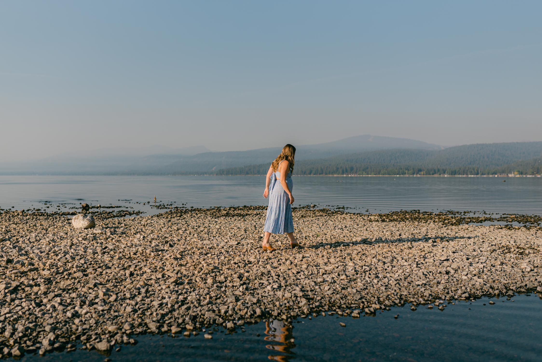Lake Tahoe Maternity Session, photo of mom-to-be walking on a Tahoe peninsula 