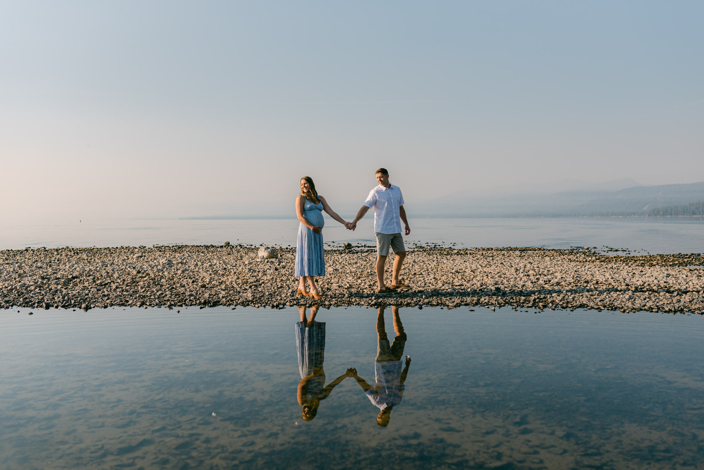 Lake Tahoe Maternity Session, photo of couple holding hands after sunrise