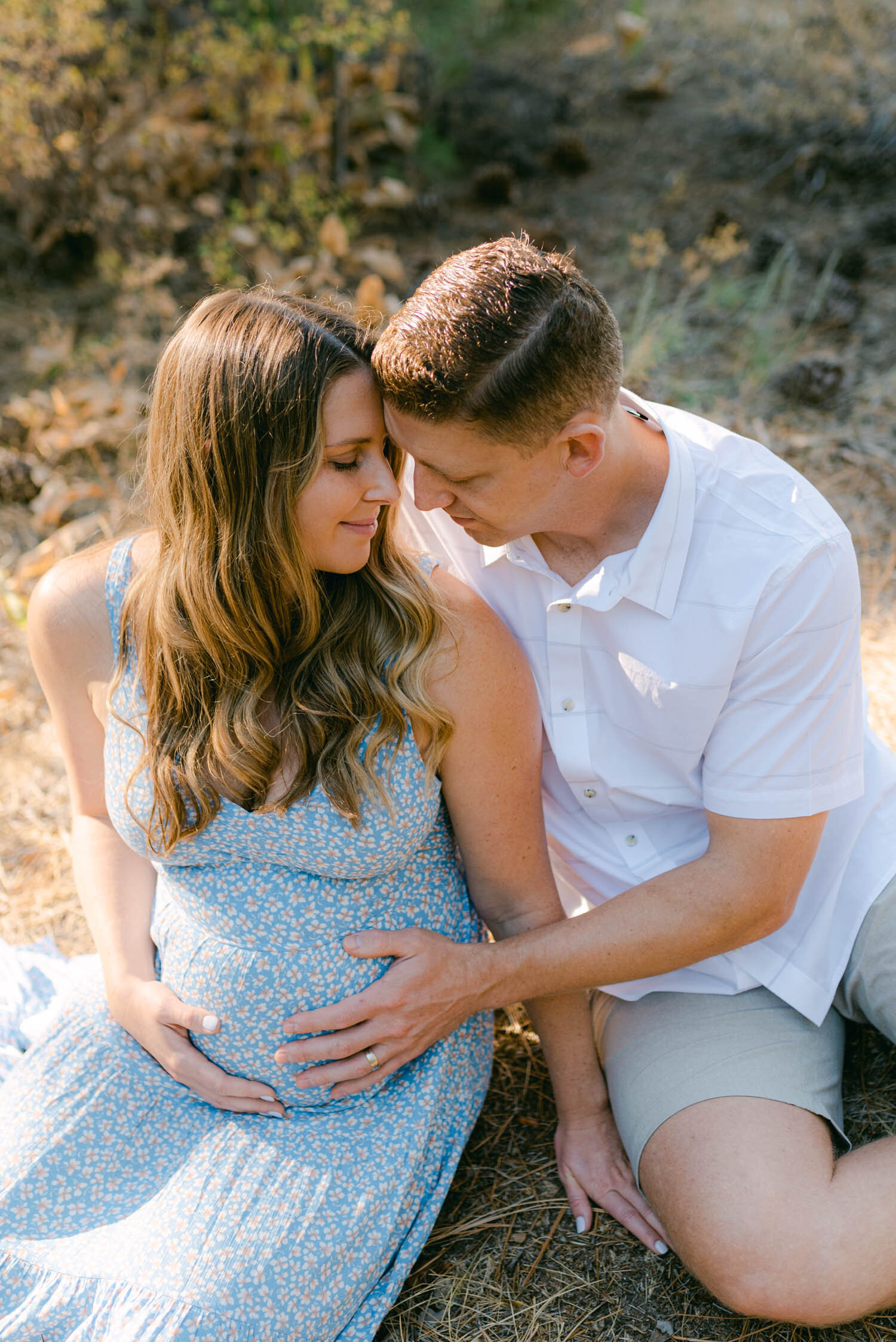 Lake Tahoe Maternity Session, photo of couple sitting in the meadows