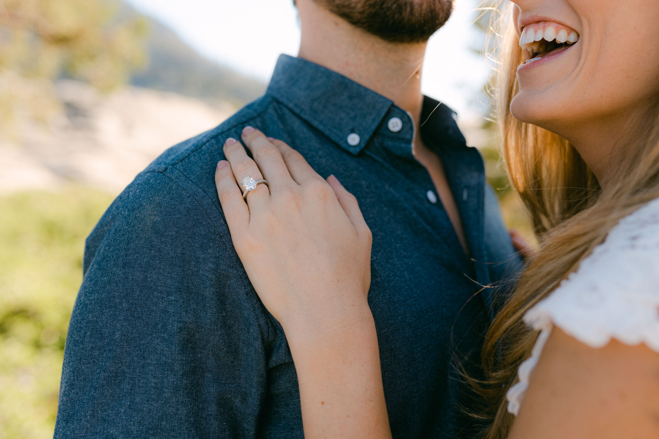 Emerald Bay engagement photoshoot, photo of an engagement ring with a thin band with diamonds 
