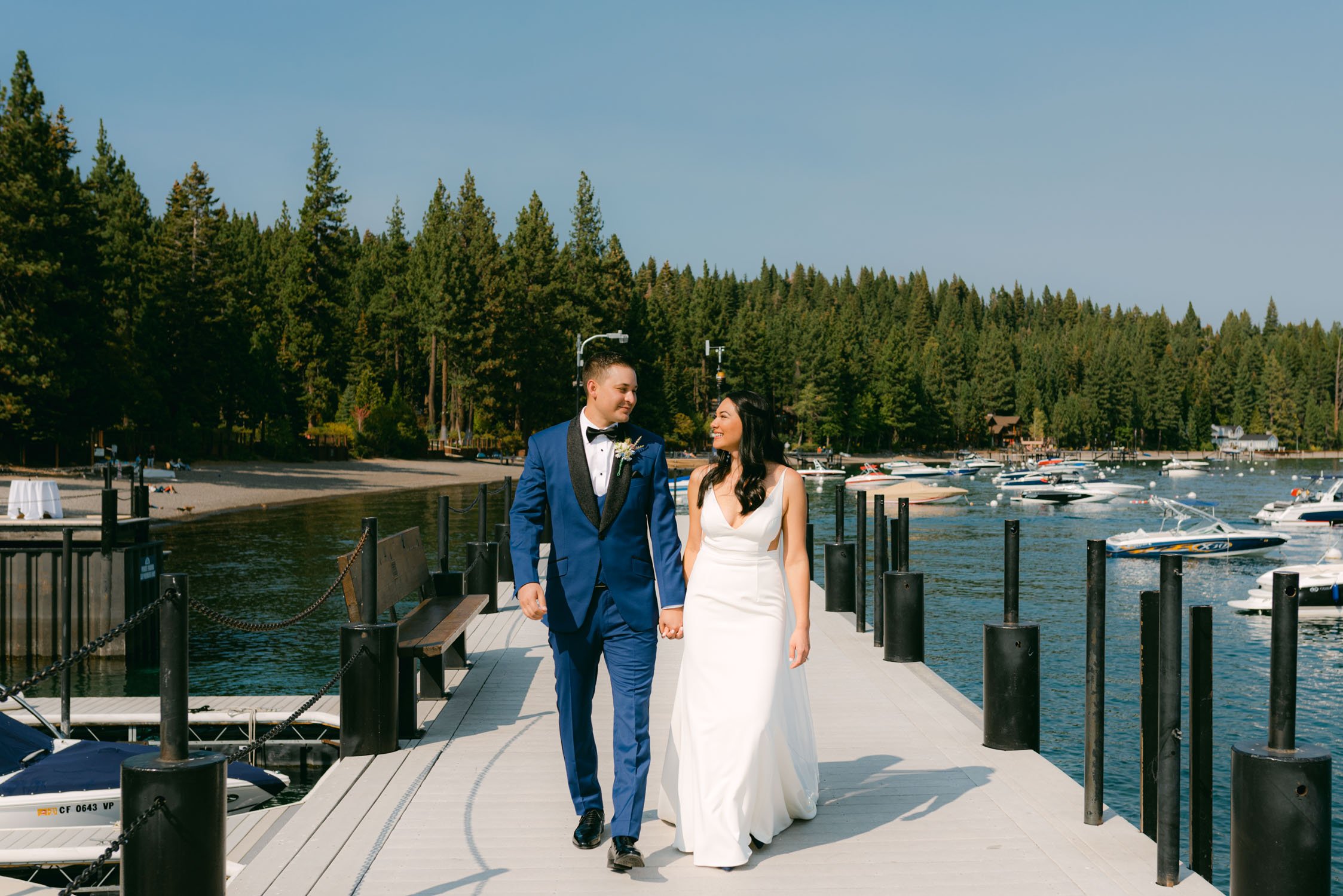 Sunnyside Tahoe Wedding, photo of couple walking on the dock at sunnyside