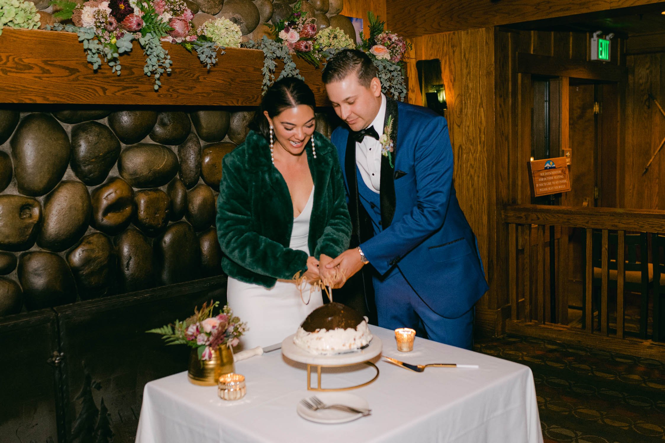 Sunnyside Tahoe Wedding, photo of couple cutting their wedding hula cake