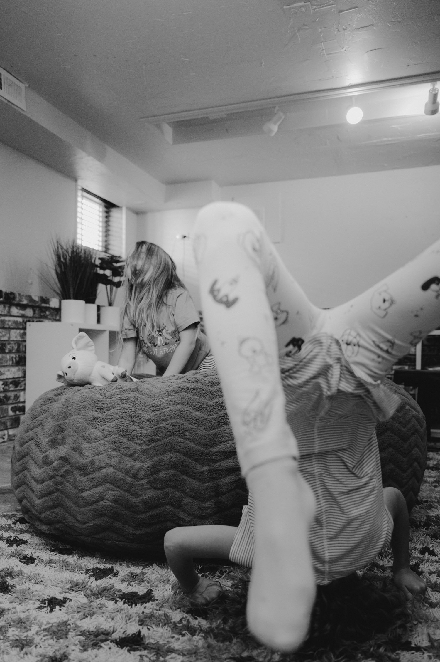 move-in photoshoot, photo of girls playing on a beanbag
