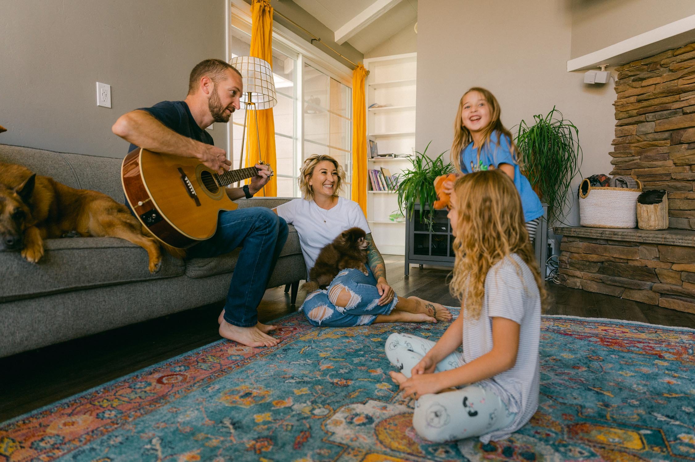 move-in photoshoot, photo of family hanging out in the living room