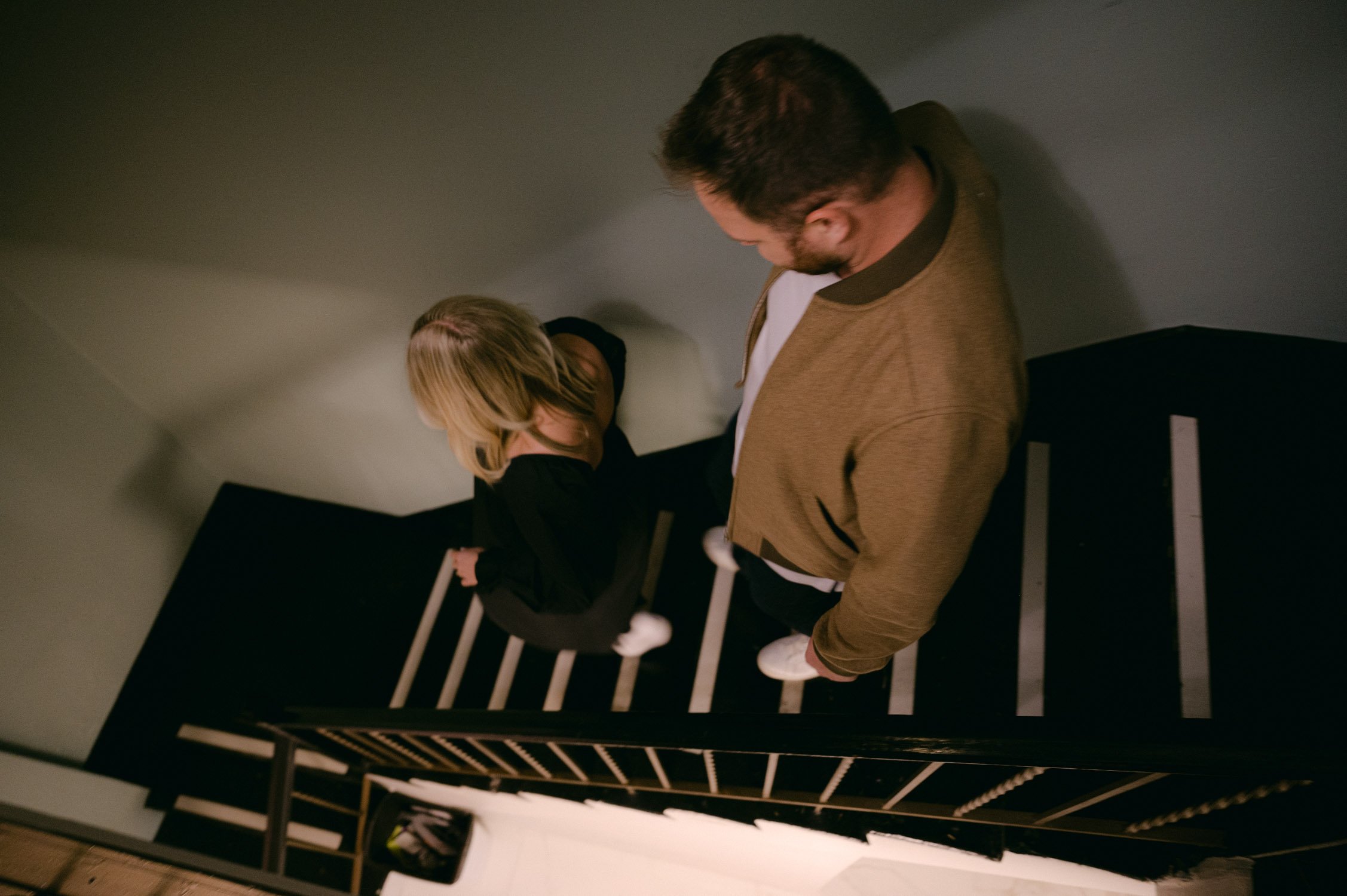 san francisco maternity session, photo of couple leaving on their apartment staircase