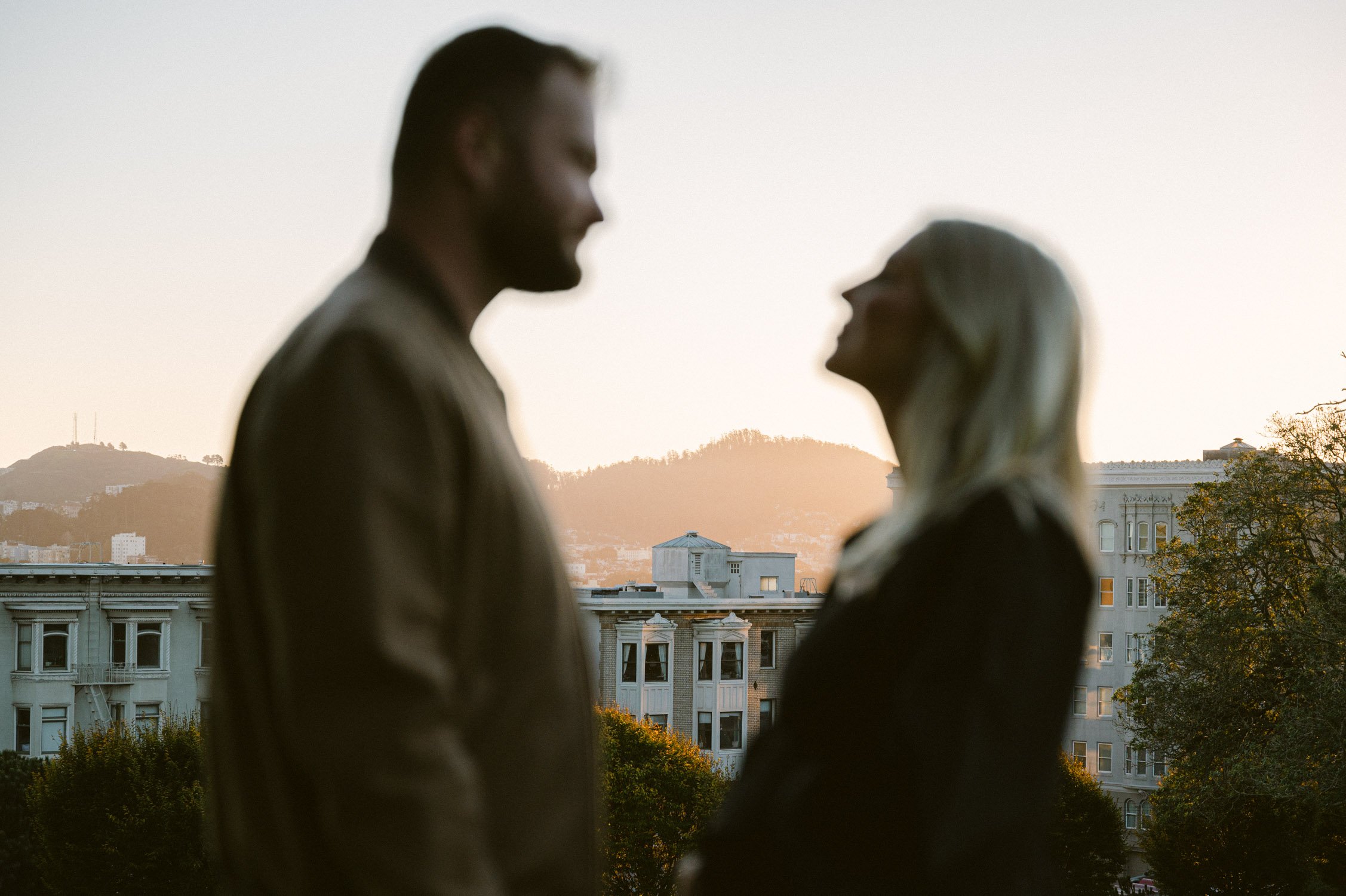  An urban san francisco maternity session, silhouette of couple at sunset 