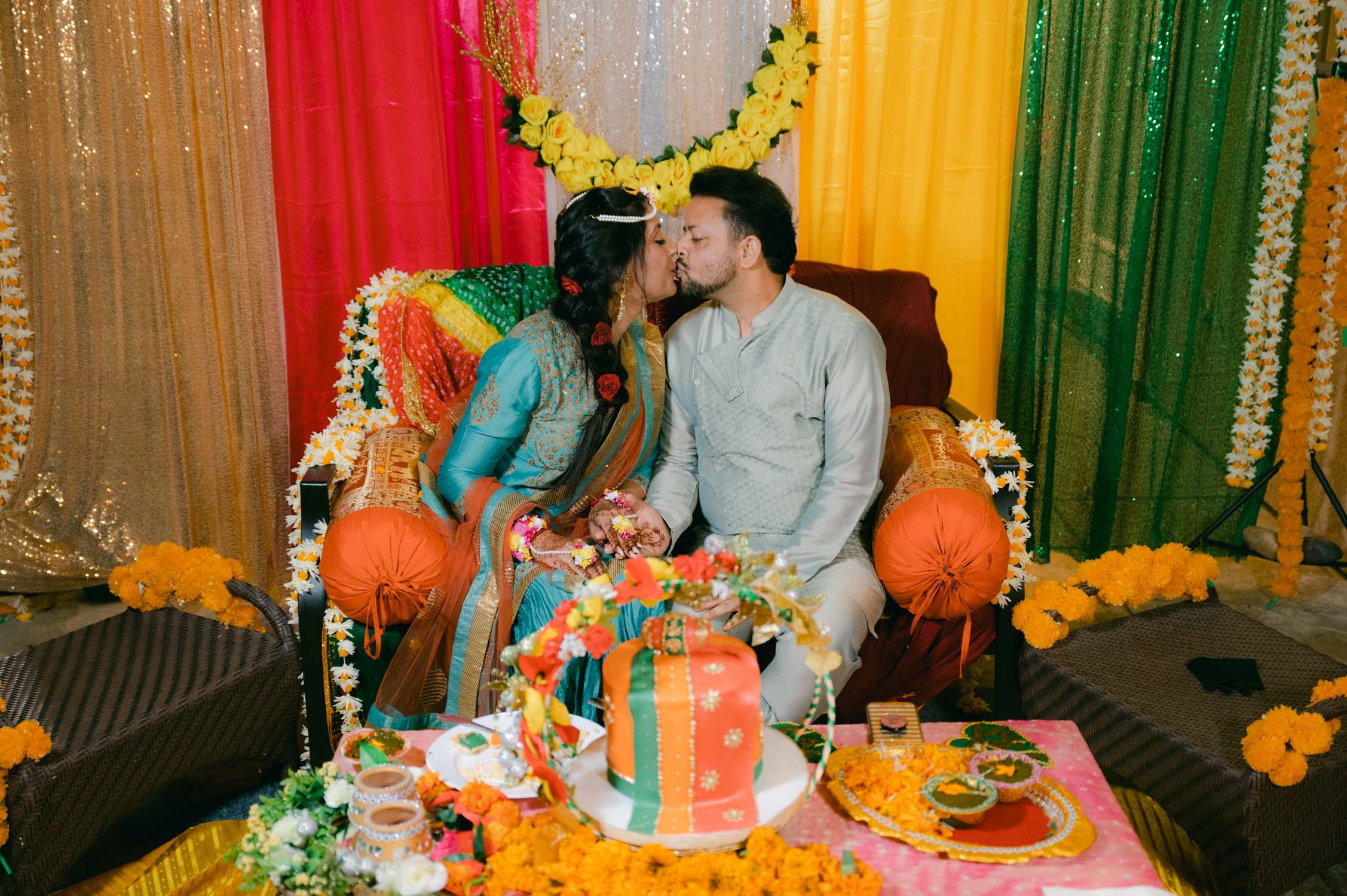 Mehendi party (Pakistani style), photo of couple kissing surrounded by their colorful decor