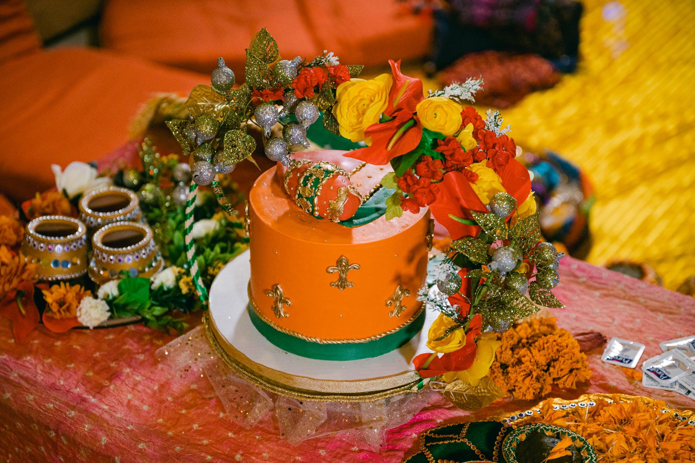 Mehendi party (Pakistani style), photo of a colorful orange cake with an egg as a topper 