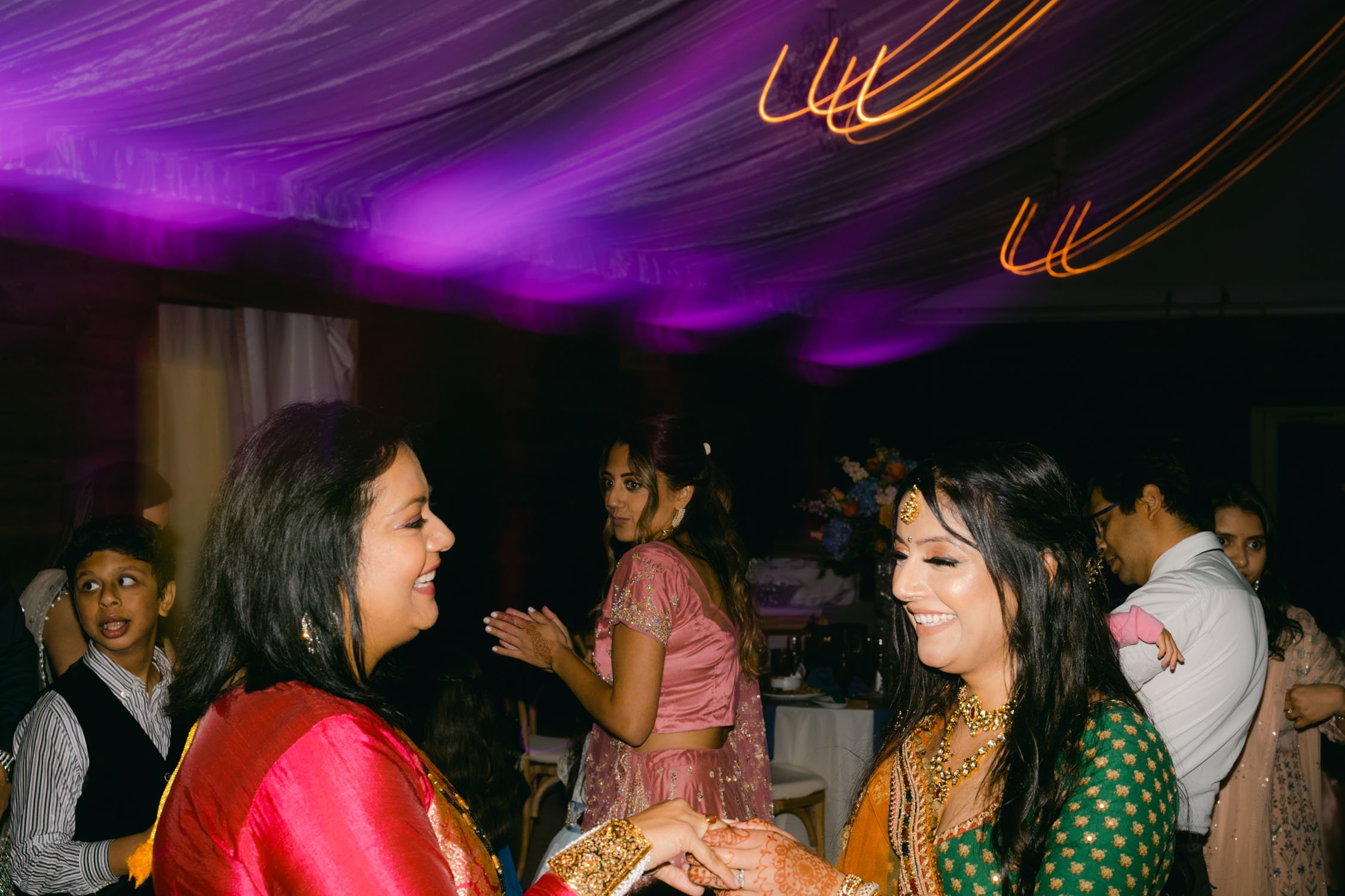 Indian wedding reception, photo of guests with dragging light