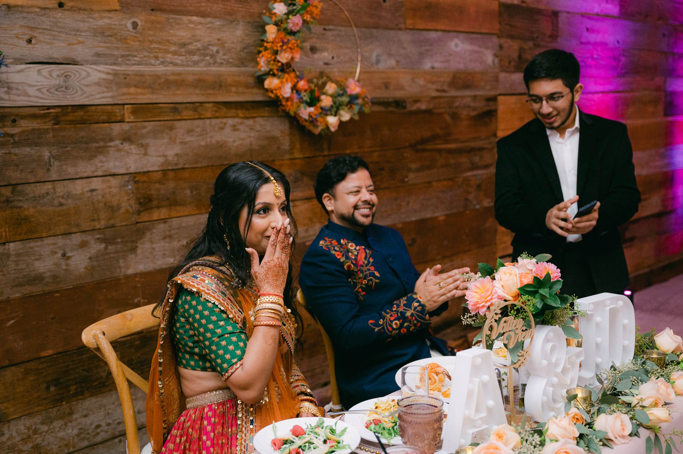 Indian wedding reception, photo of couple at their sweetheart table