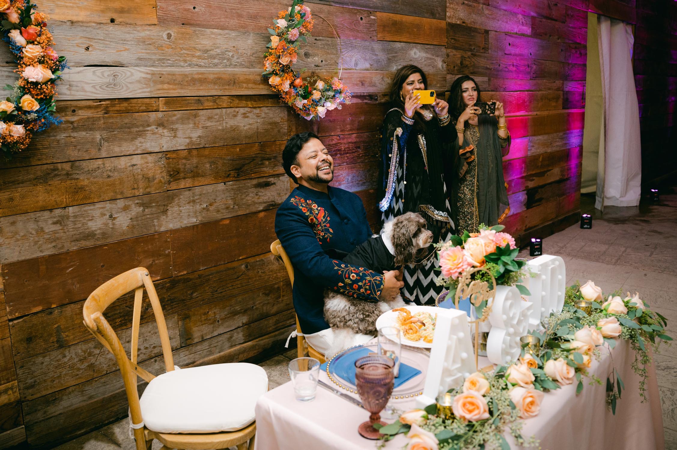 Indian wedding reception, photo of groom reacting to his bride's dance