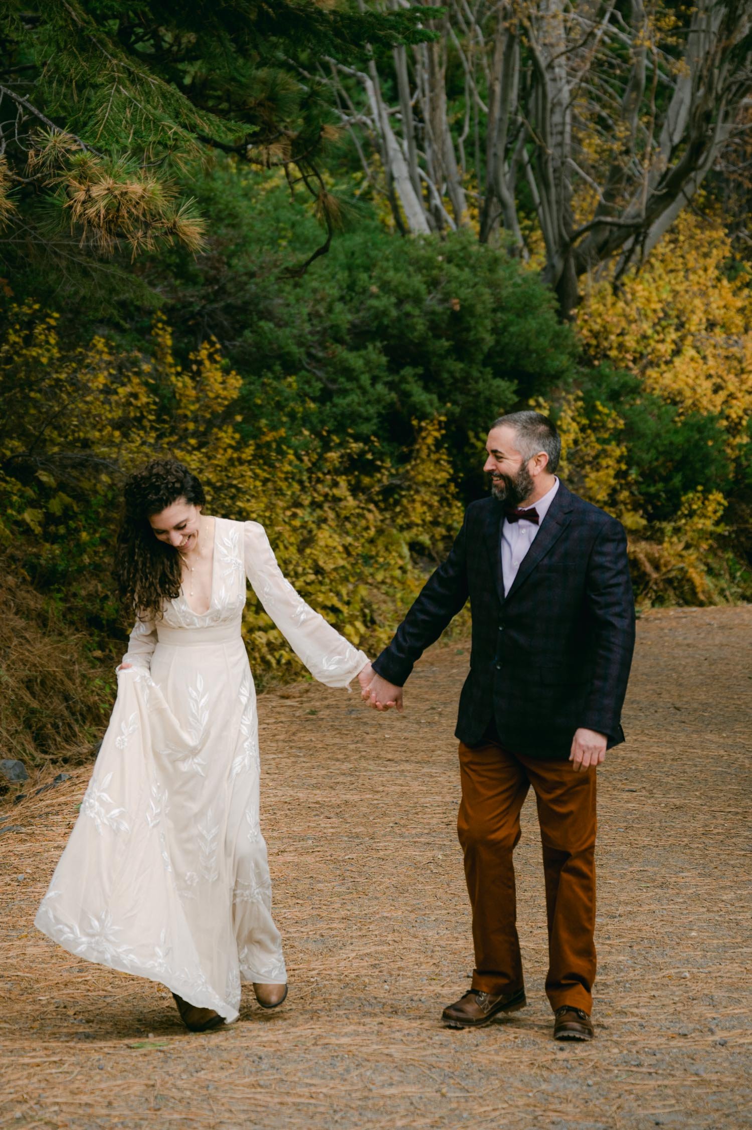 Lake Tahoe elopement photographer, photo of couple holding hands on a trail at Emerald Bay
