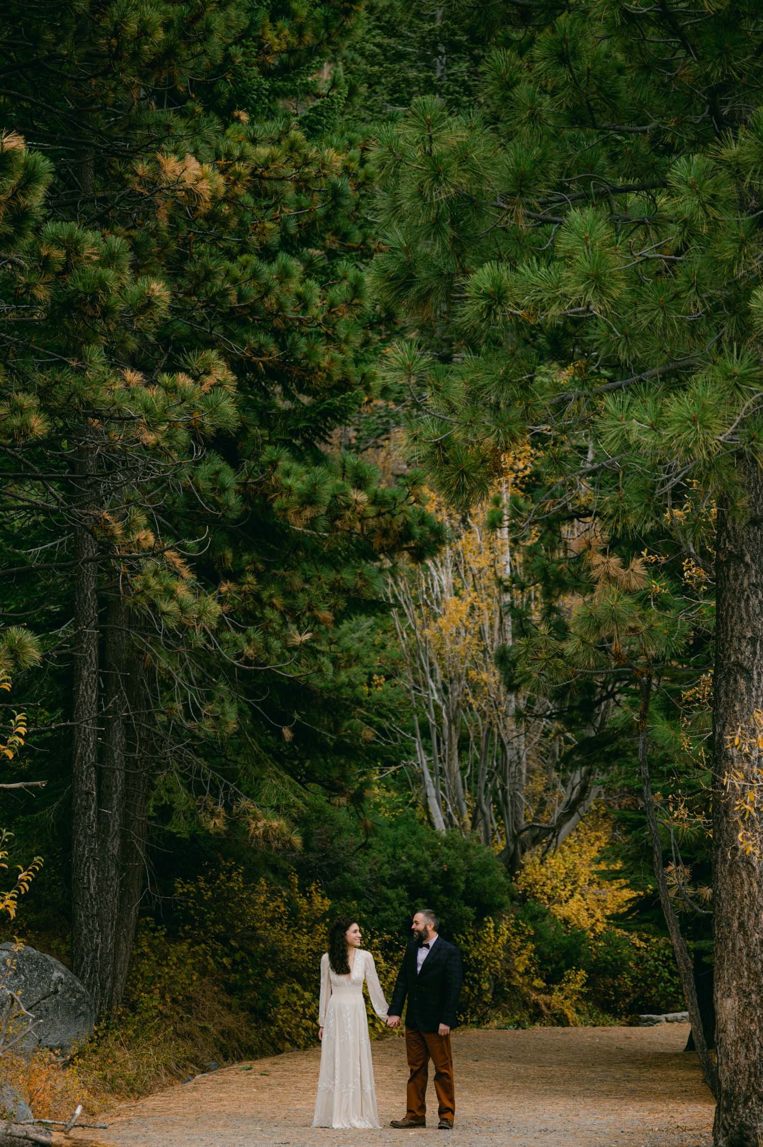 Lake Tahoe elopement photographer, photo of couple walking on a trail at Emerald Bay