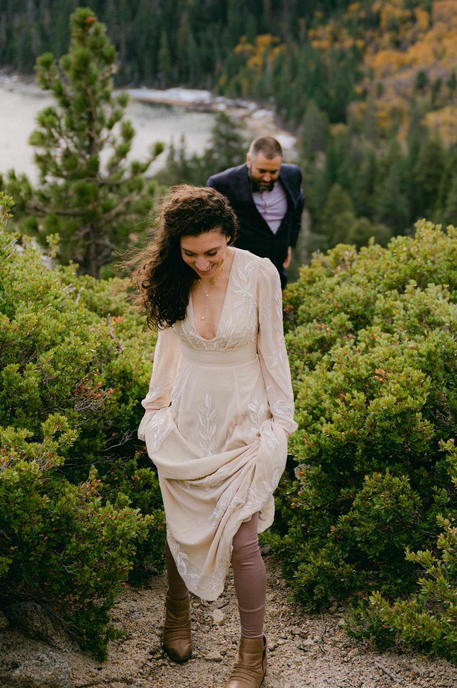 Lake Tahoe elopement photographer, photo of brides hiking in her wedding dress