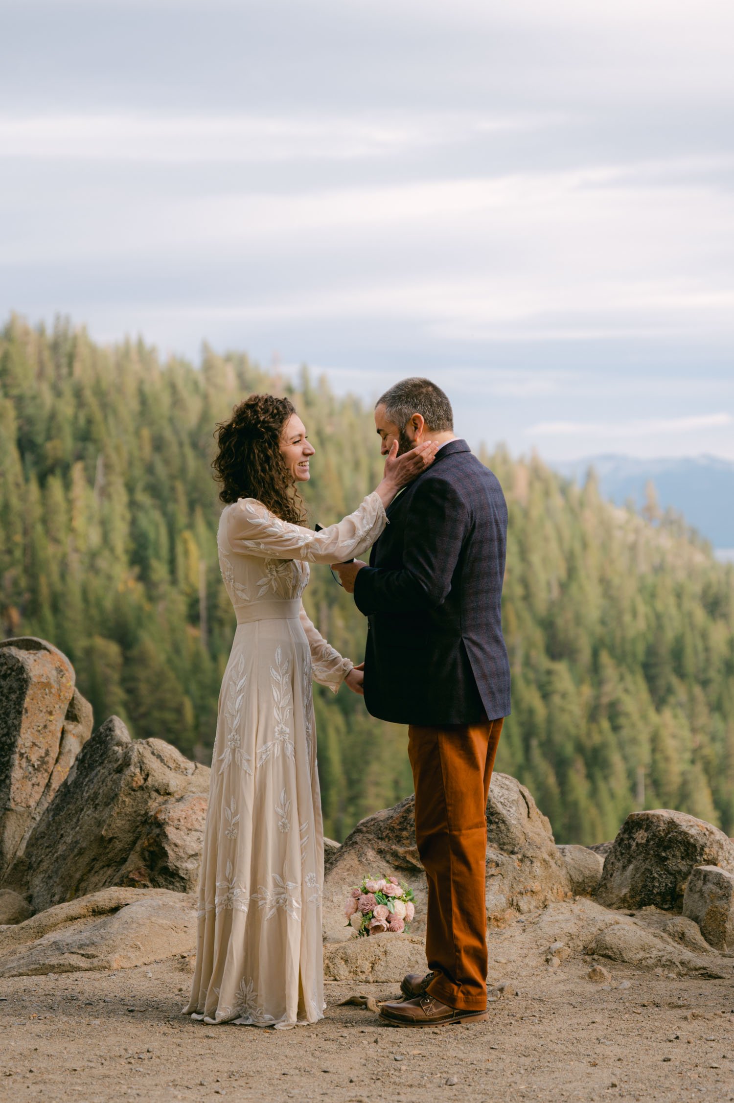 Emerald Bay Elopement, photo of a groom reading his vows at an overlook