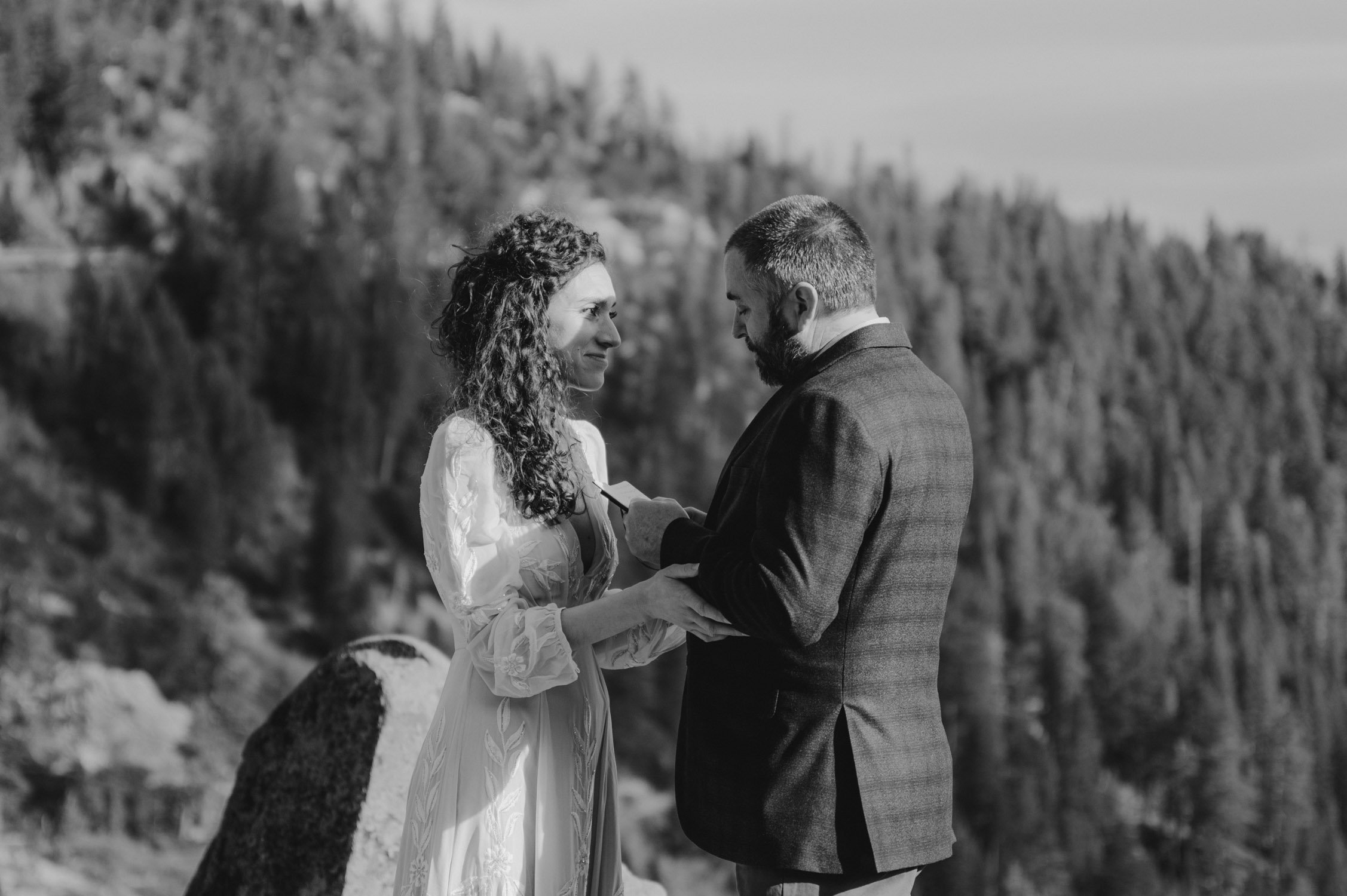 Emerald Bay Elopement, photo of couple reading their vows on a private outlook
