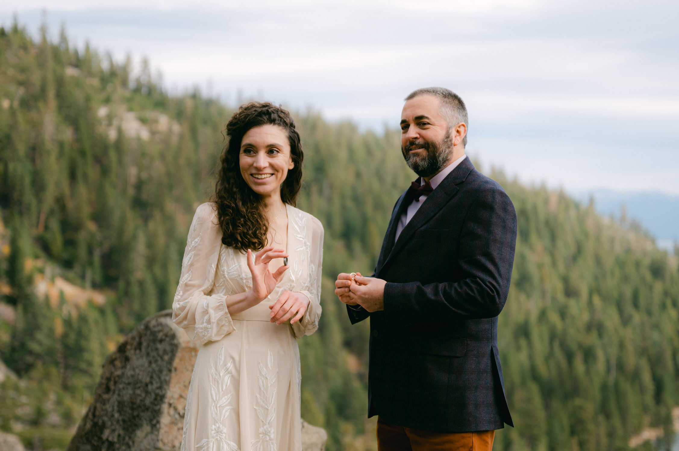 Emerald Bay Elopement, photo of couple holding their wedding bands