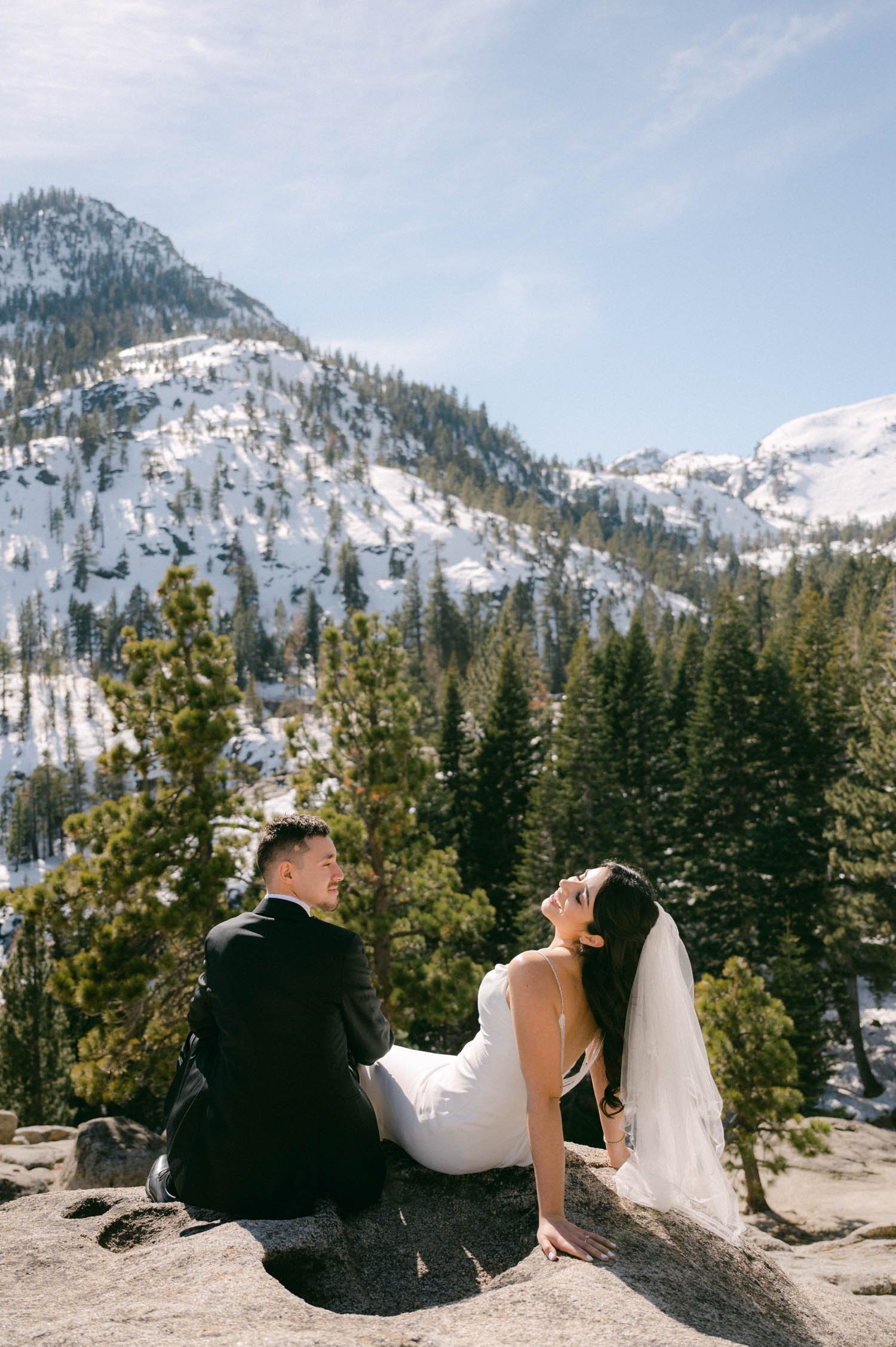 Tahoe Bleu Wave Wedding photo of couple sitting on a granite rock
