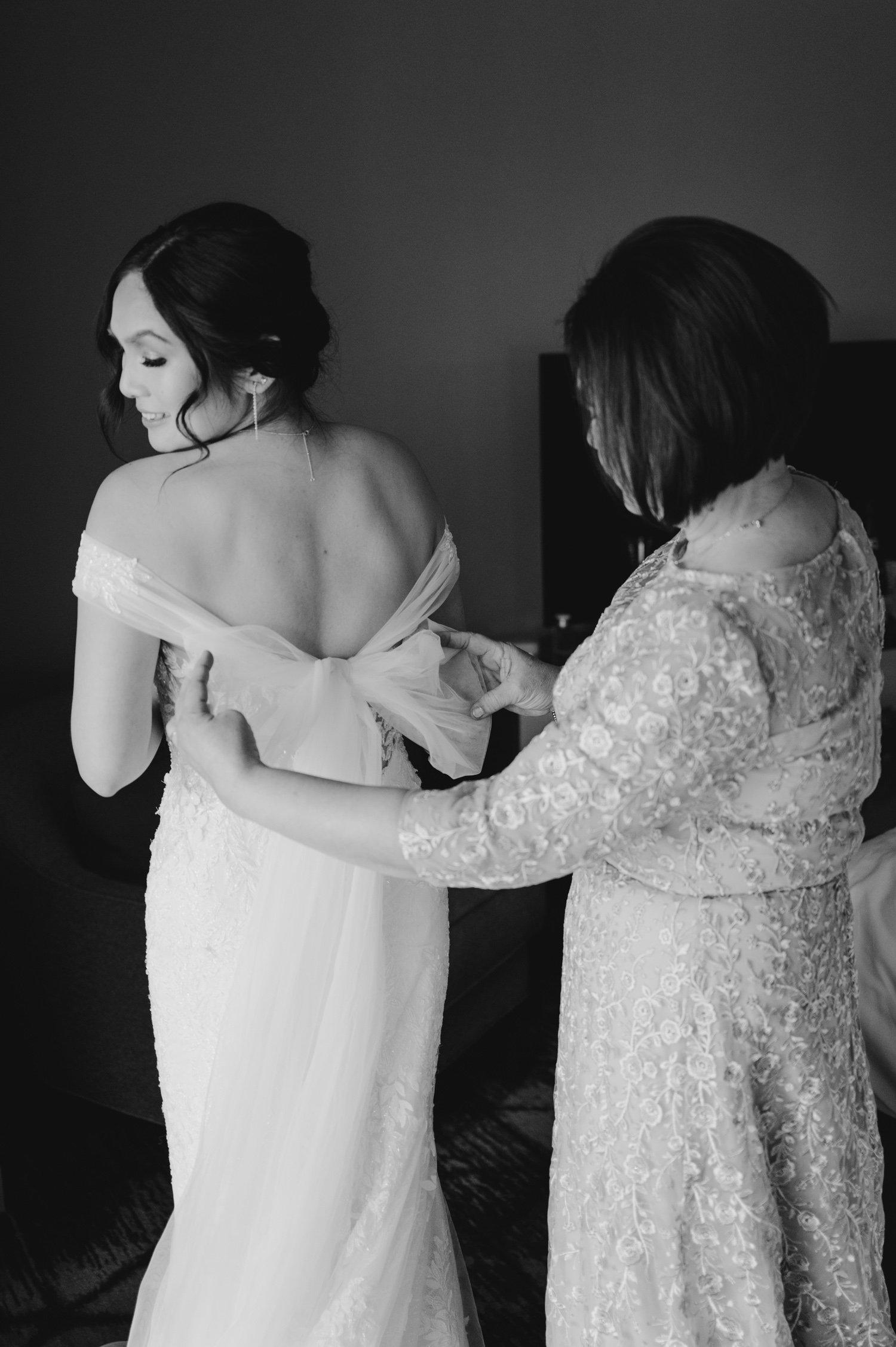 Edgewood Tahoe wedding photos, photo of bride's mom helping her with her dress
