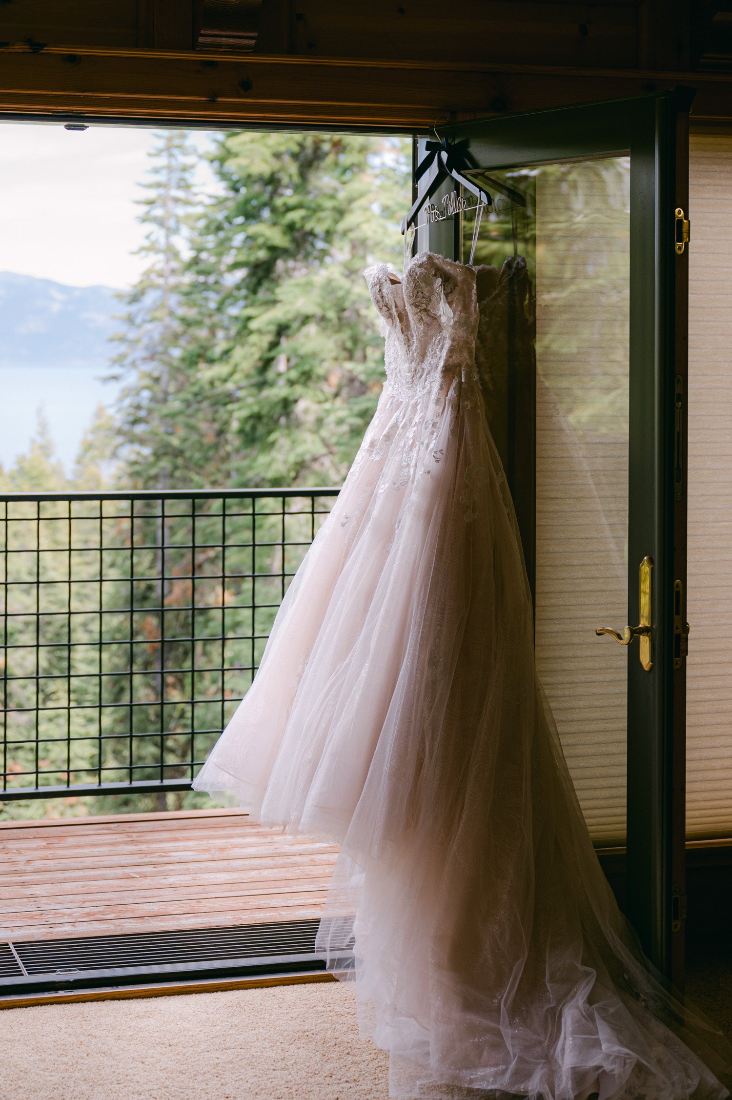 Lake Tahoe elopement, photo of dress hanging on the door