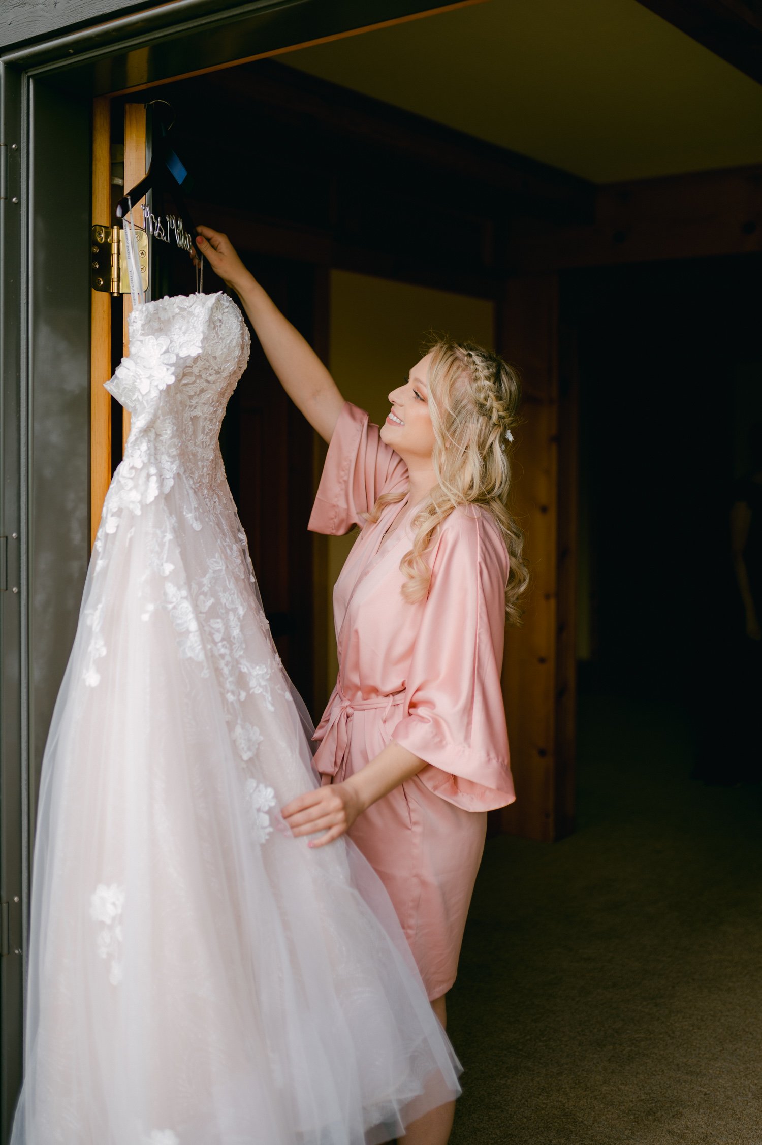 Lake Tahoe elopement, photo of bride getting her wedding dress