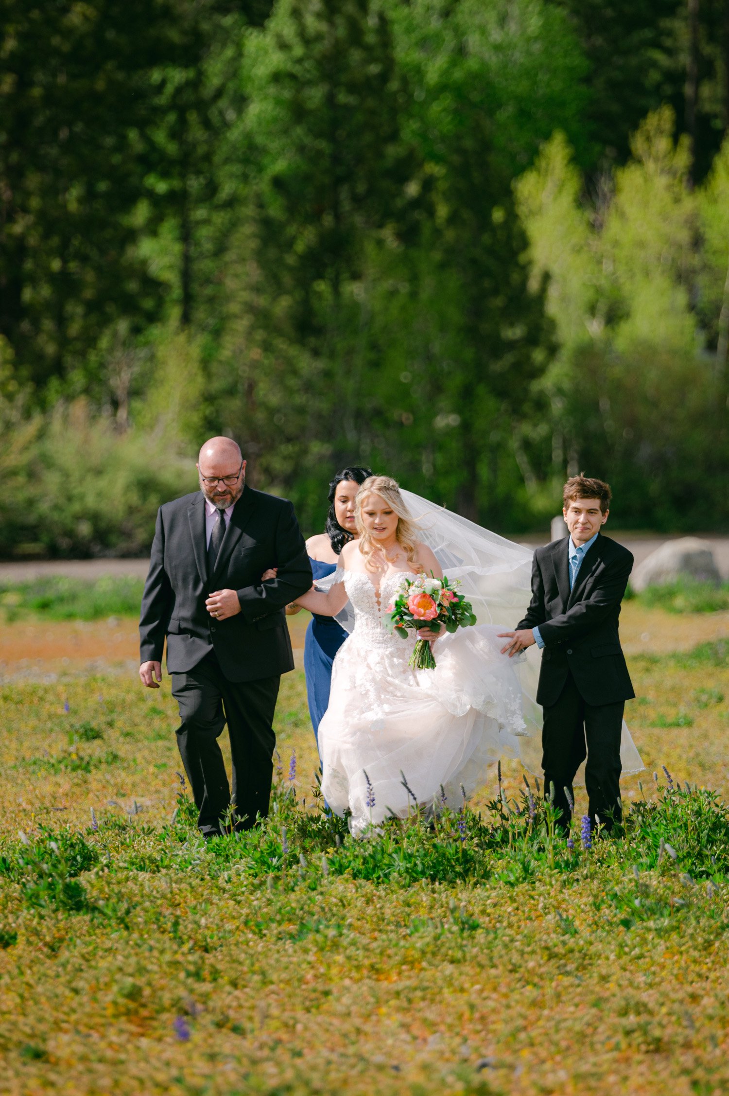 Lake Tahoe elopement, photo of bride walking down the aisle in the meadows in Tahoe