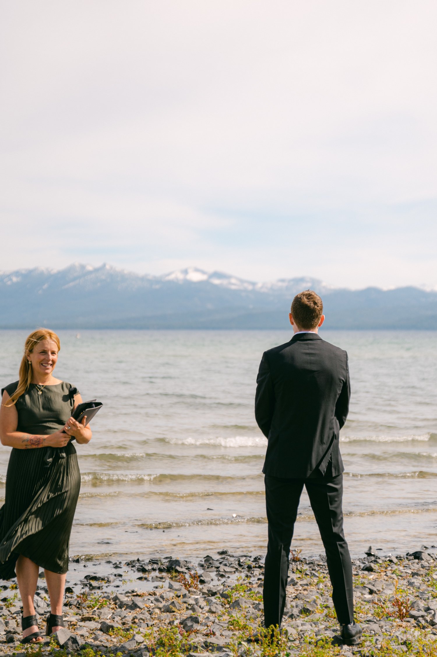 Lake Tahoe elopement, photo of groom looking away as the bride walks up to him
