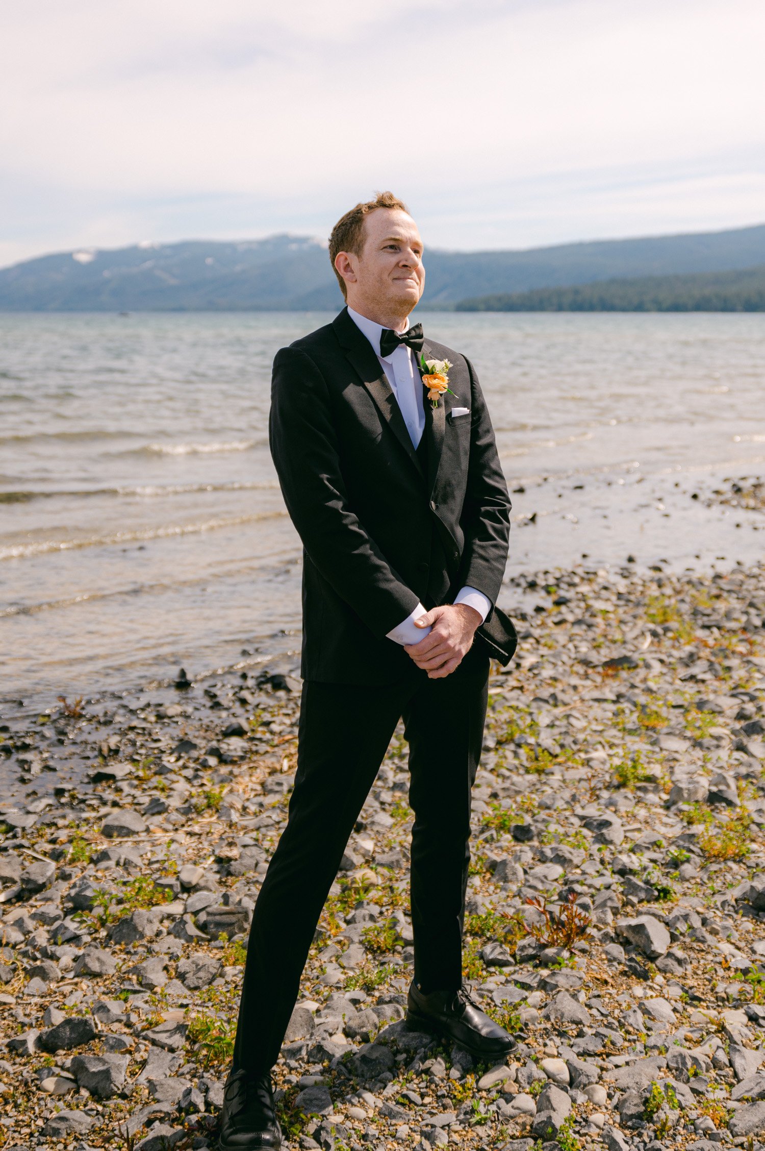 Lake Tahoe elopement, photo of groom's reaction to seeing his bride walk down the aisle