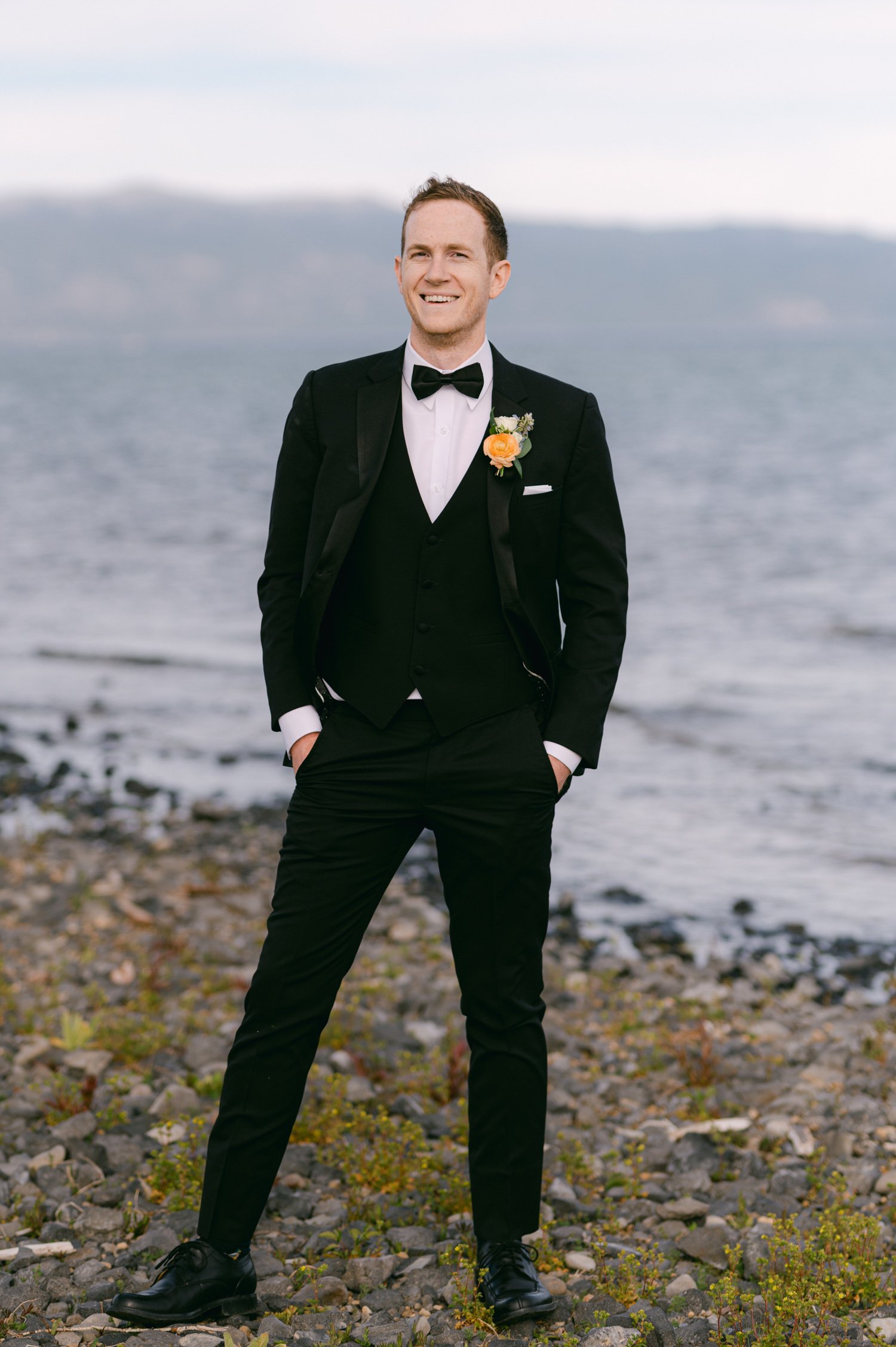 Lake Tahoe elopement photos, photo of groom wearing a black tux