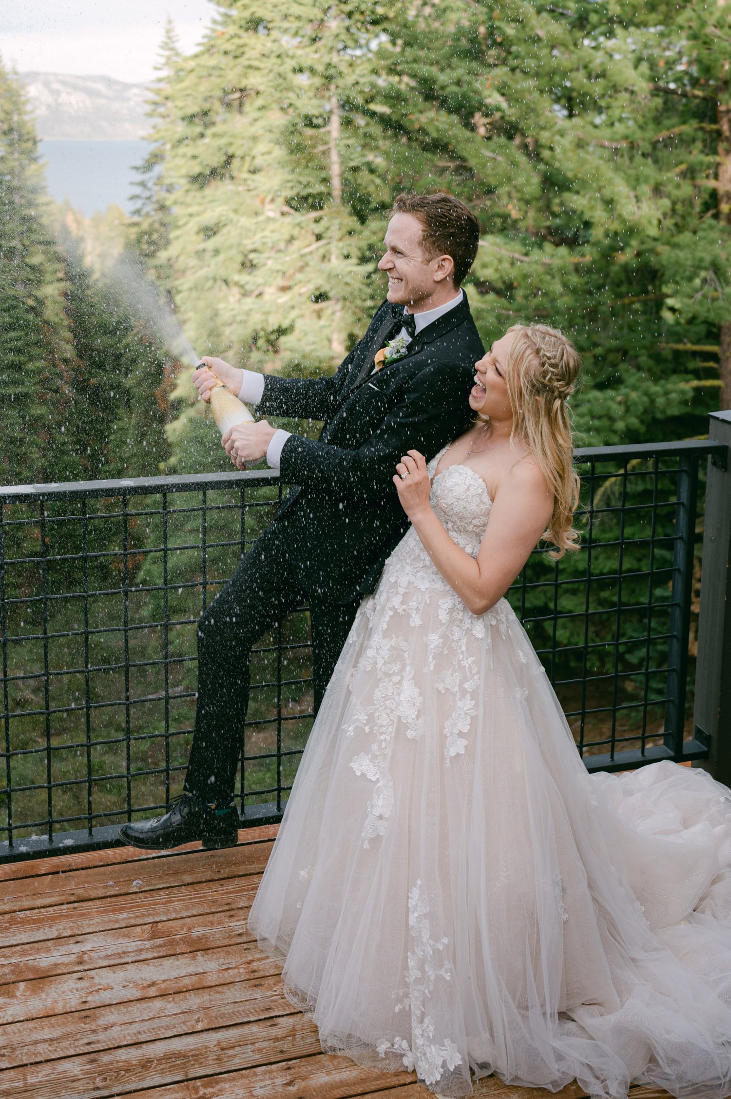 Lake Tahoe elopement photos, photo of couple popping champagne 