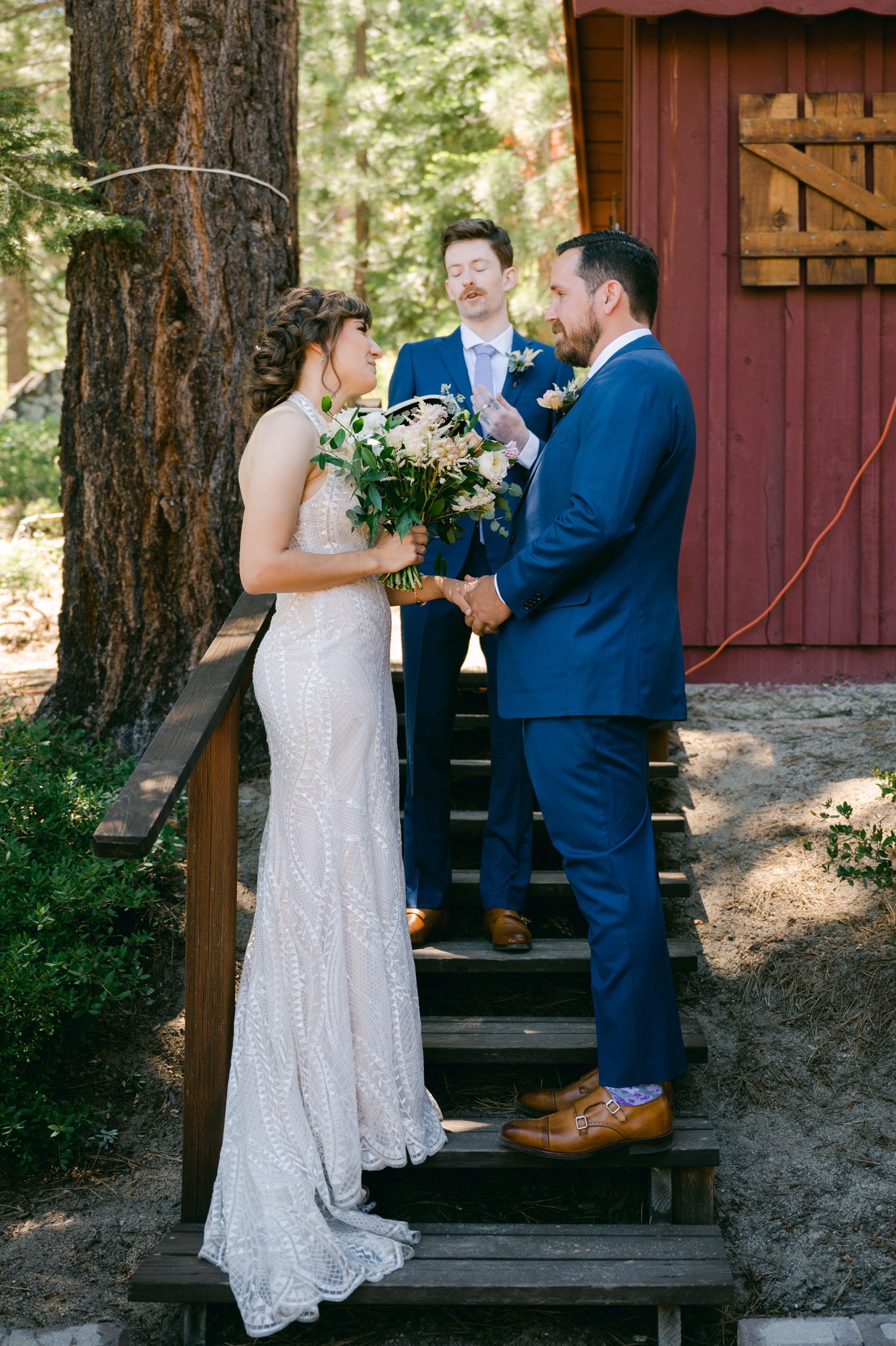 Adventure elopement in Lake Tahoe, photo of couple having their ceremony at a lake tahoe cabin