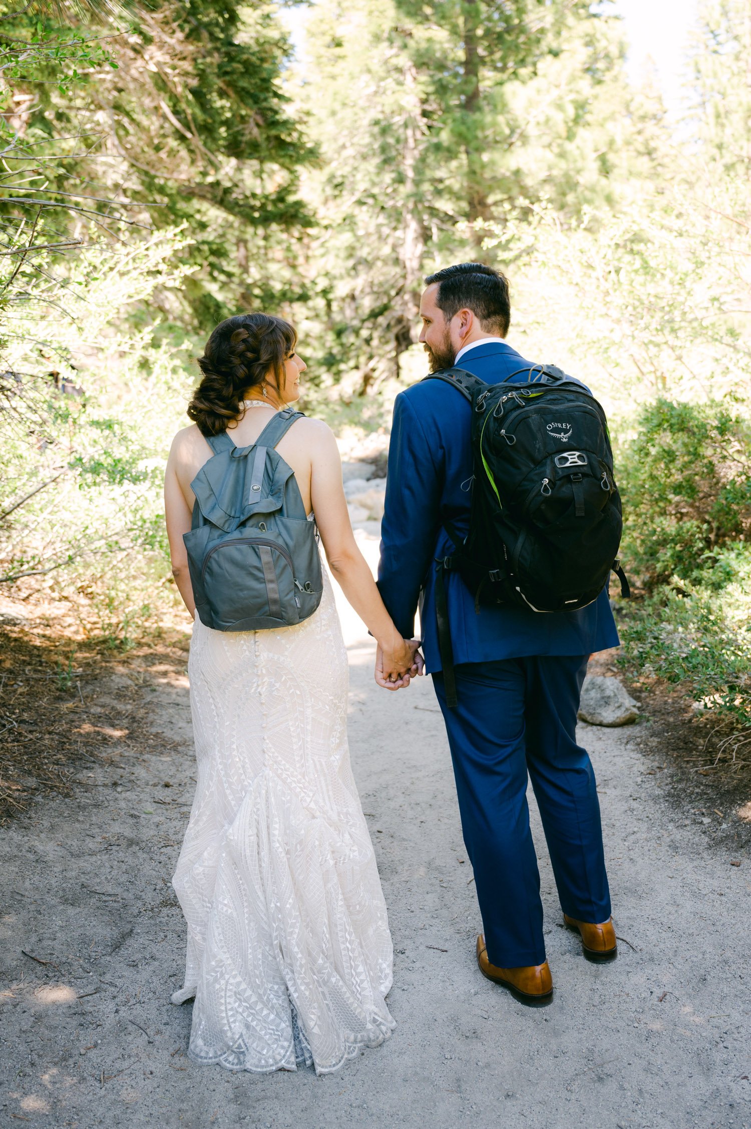 Adventure elopement in Lake Tahoe, photo of couple walking on a trail at desolation wilderness 