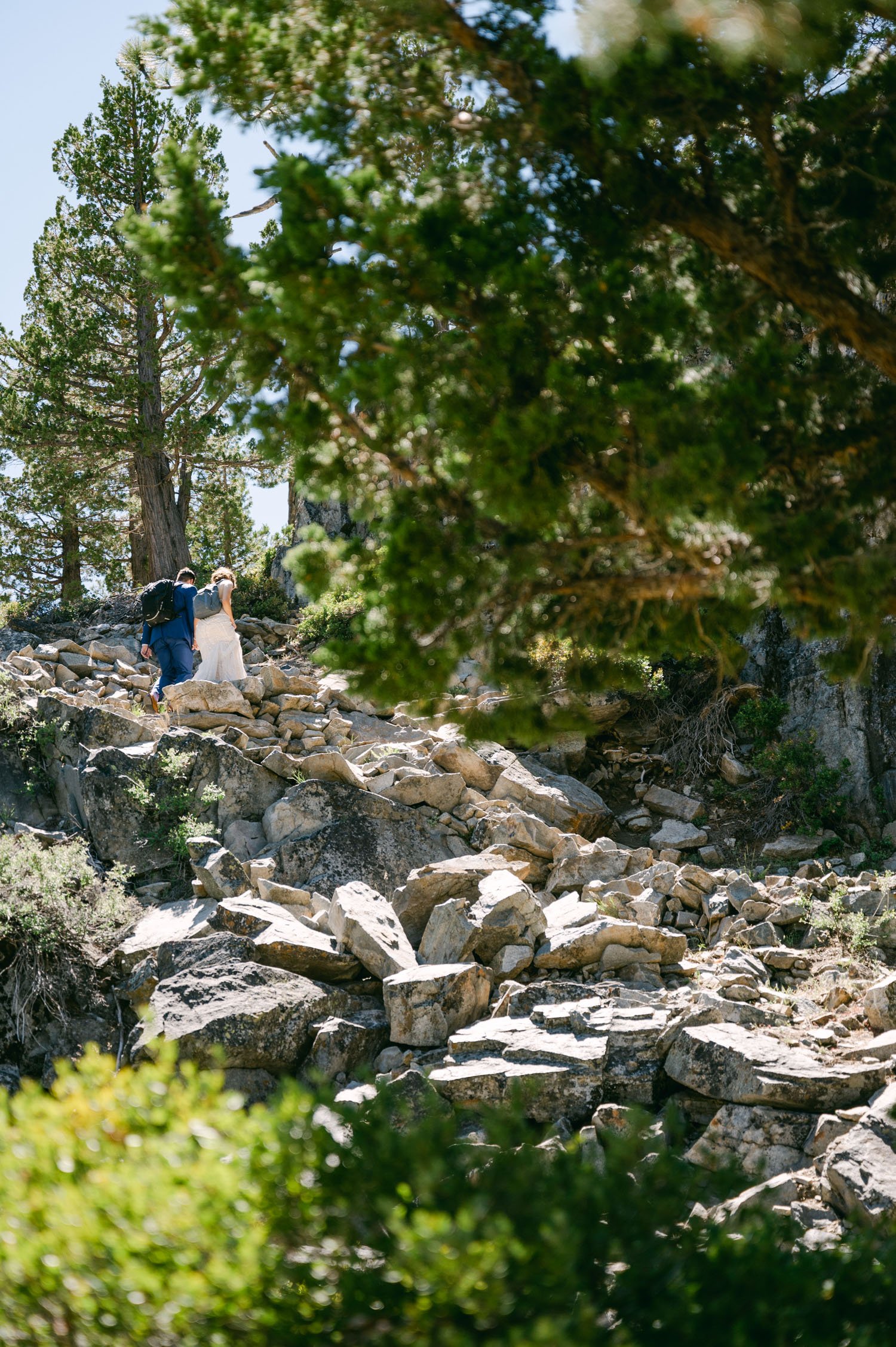 Adventure elopement in Lake Tahoe, photo of couple hiking up