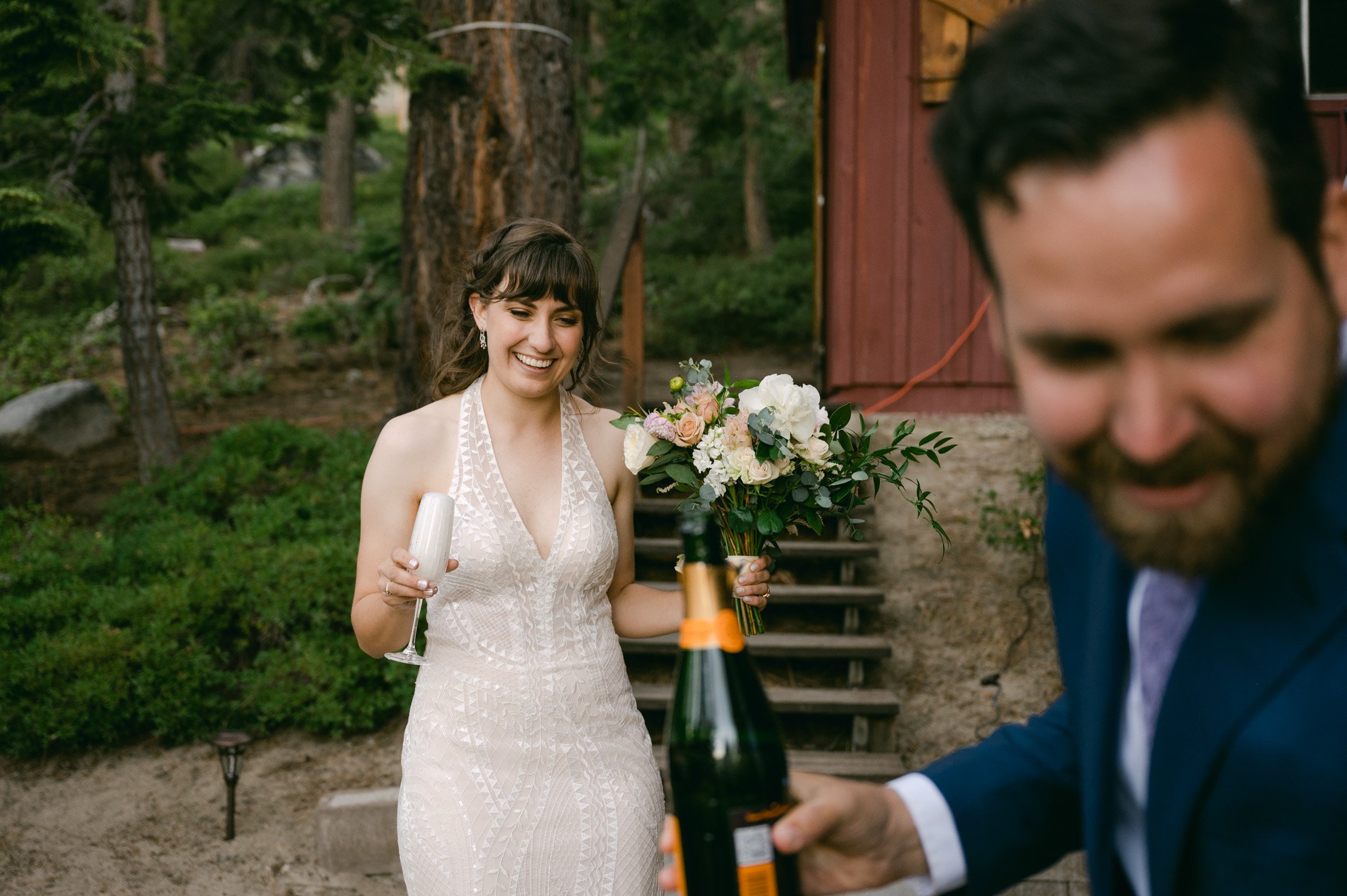 Adventure elopement in Lake Tahoe, photo of bride and champagne 
