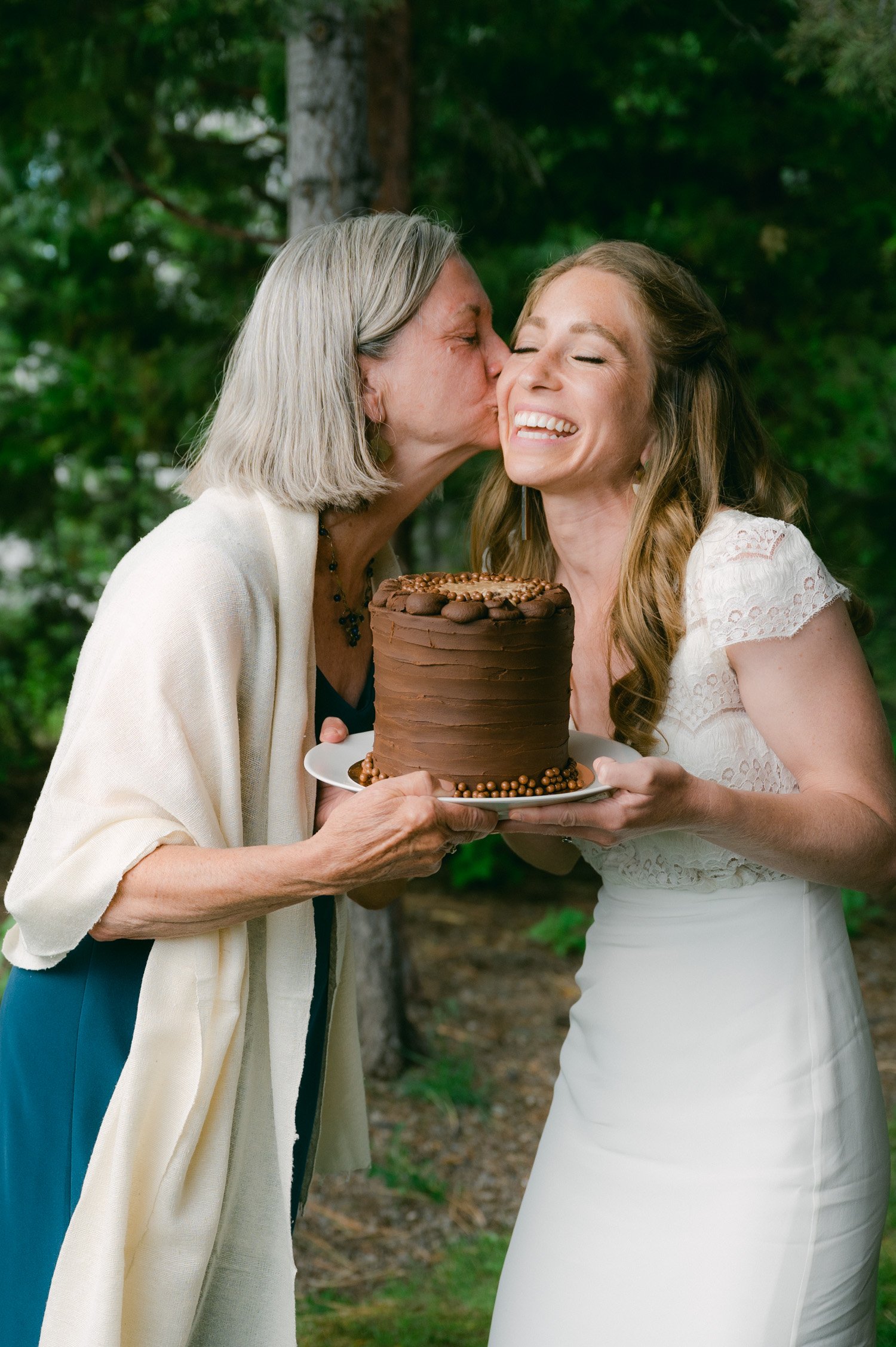West Shore Private Estate Wedding, photo of  bride surprising her mom with a wedding cake