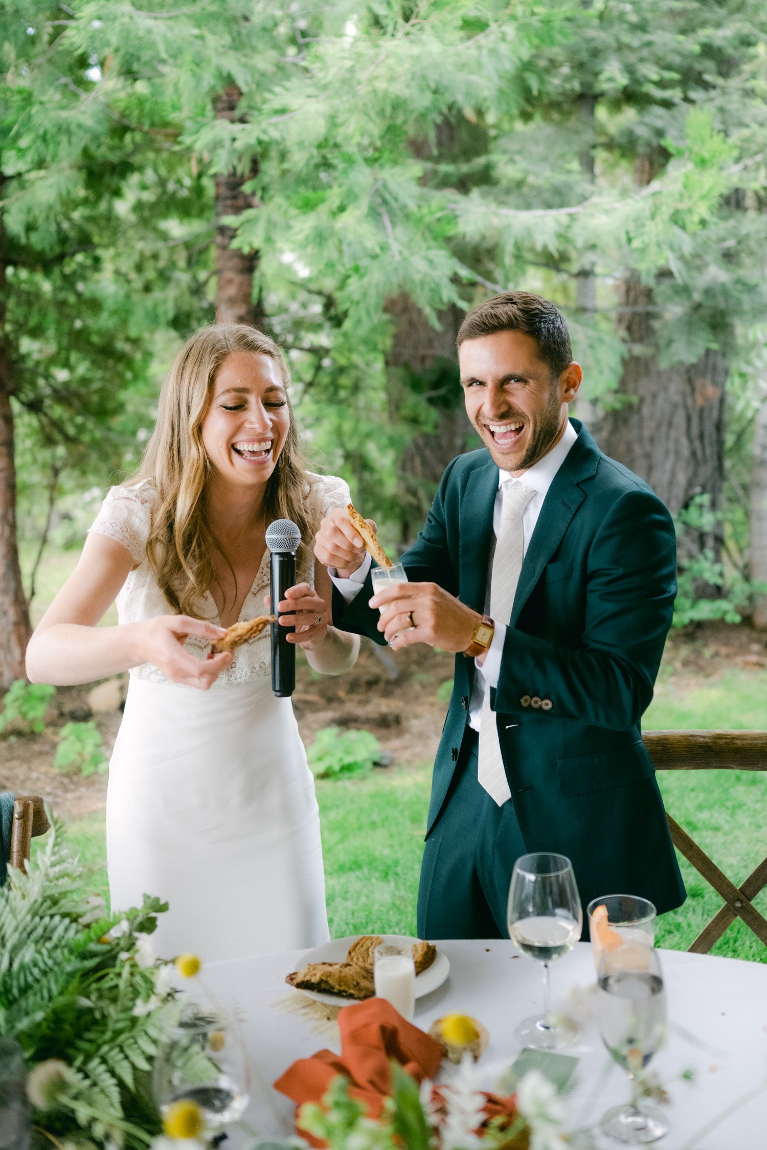 West Shore Private Estate Wedding, photo of couple dunking cookies instead of cutting a cake
