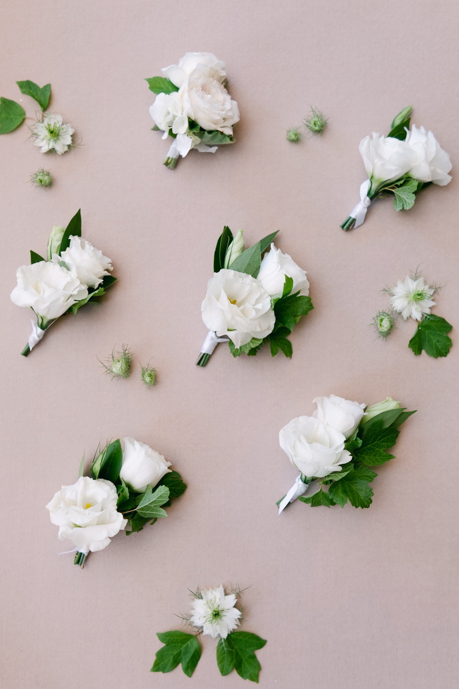 Martis Camp wedding photo of white boutonnières 