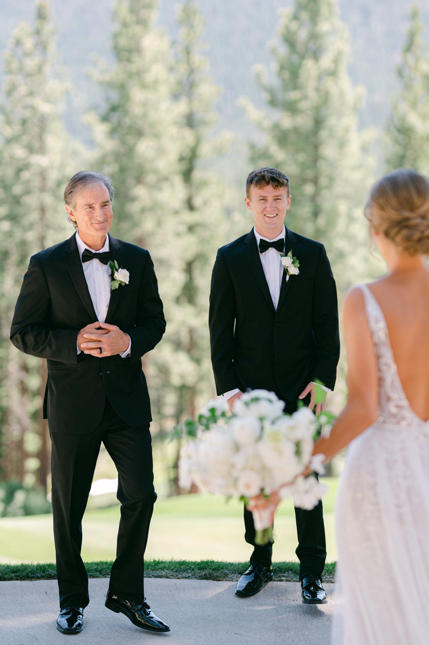 Martis Camp Wedding photo of a bride's first look with her father and brother