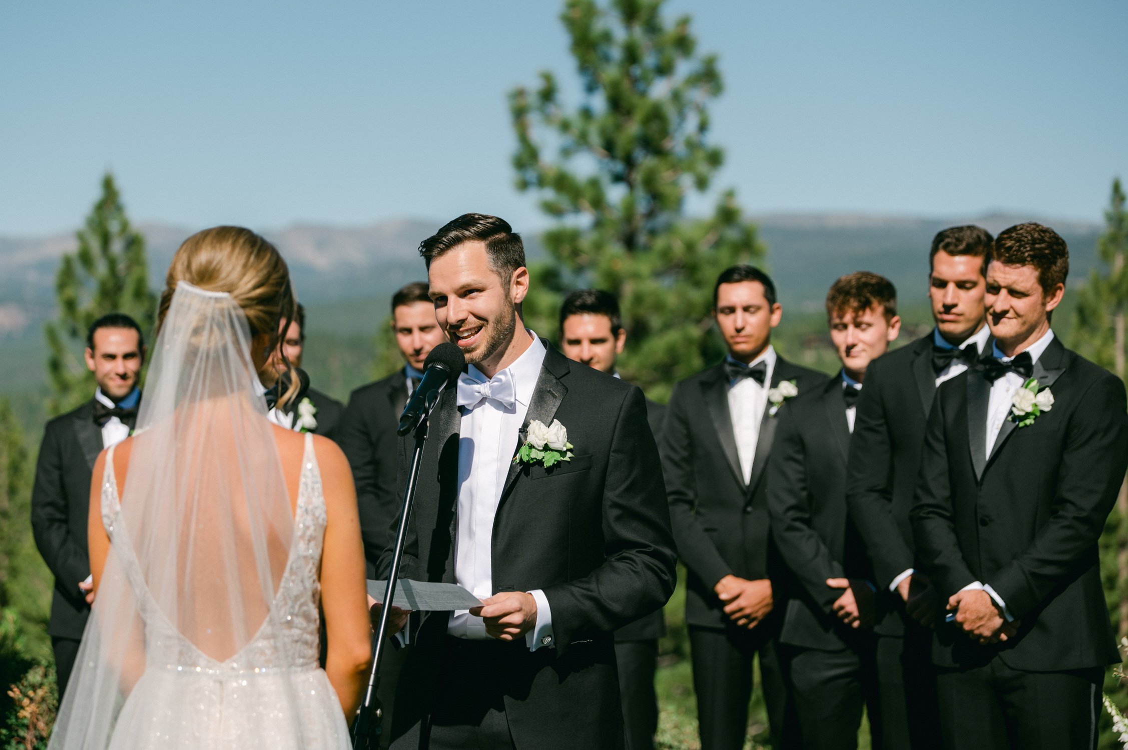 Martis Camp wedding, photo of groom reading his vows 