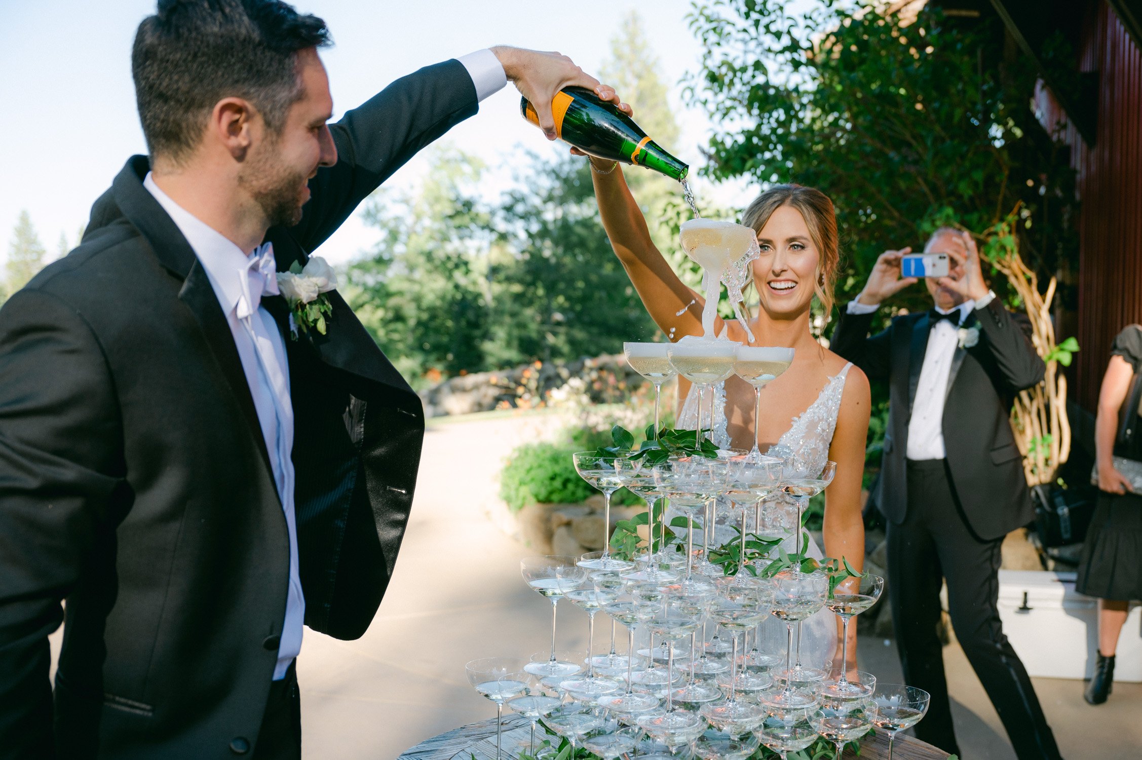 Martis Camp wedding, photo of couple pouring champagne 
