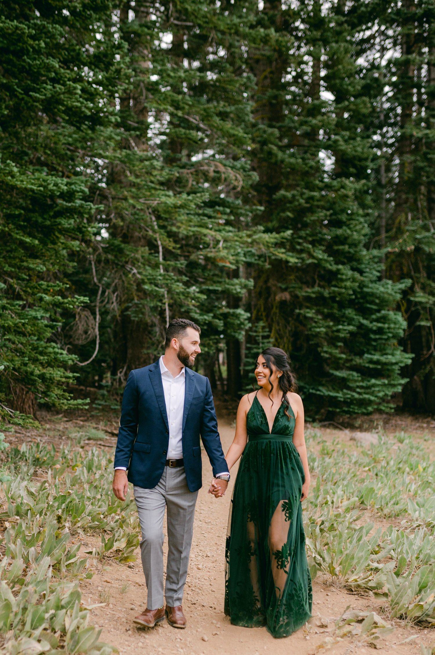 Lake Tahoe Engagement photos, photo of couple walking in the forest 