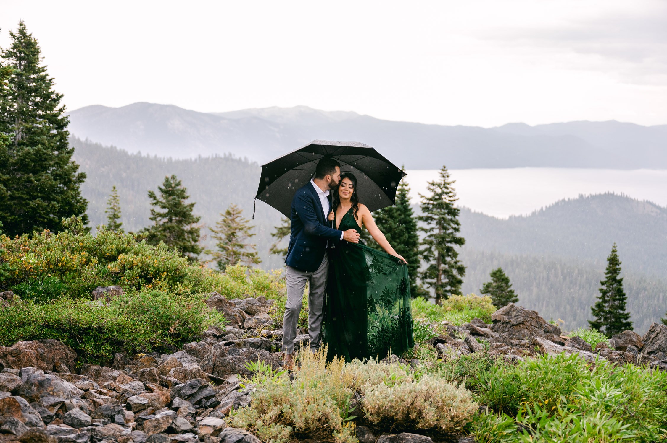 Lake Tahoe Engagement photos, photo of couple under an umbrella during some rain showers