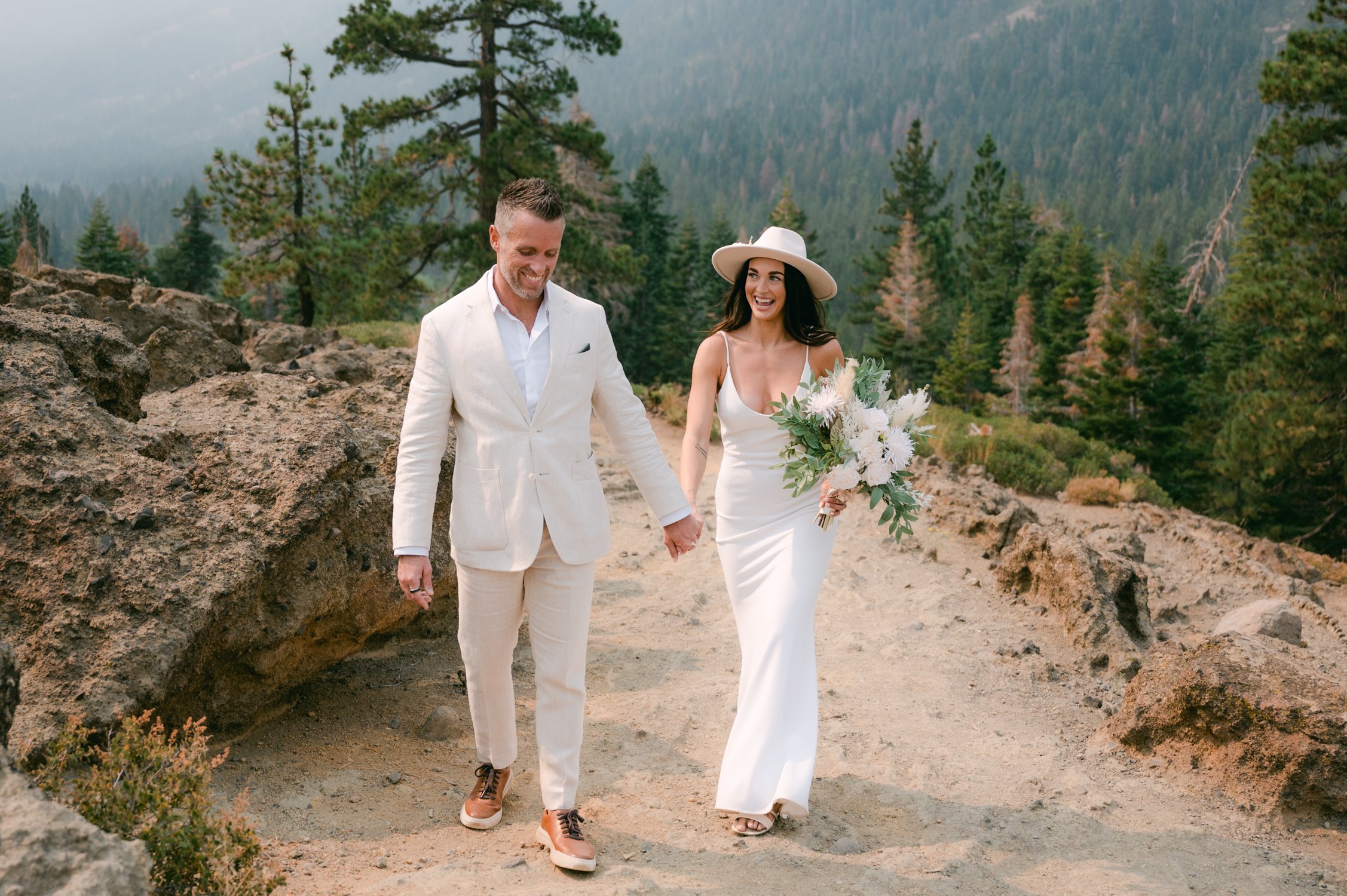 Lake Tahoe Yacht wedding, photo of couple hiking up a mountain