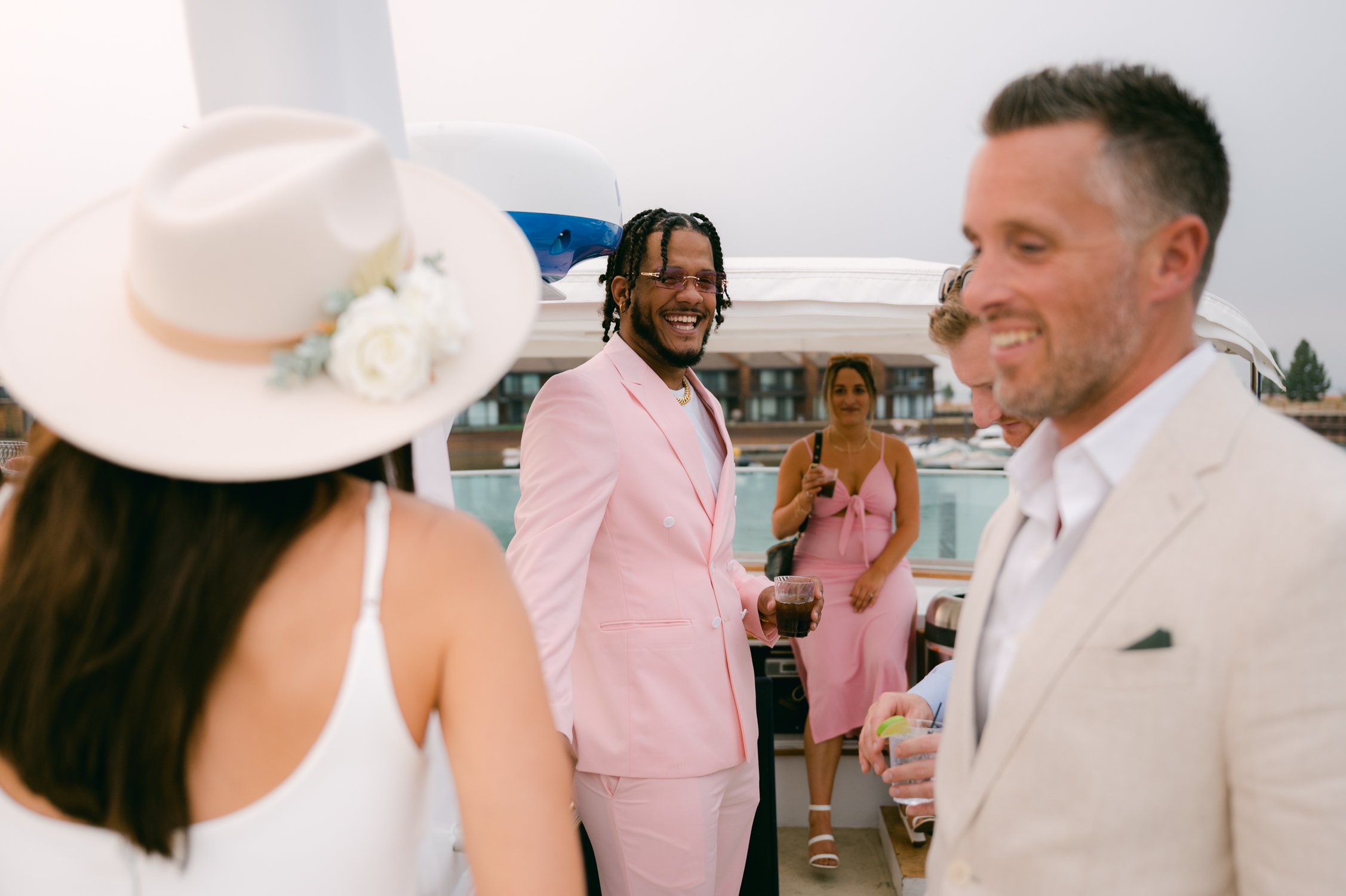 Lake Tahoe Yacht wedding, photo of guest wearing a pink suit