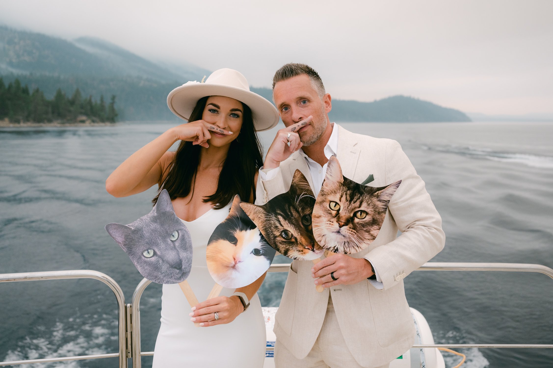 Lake Tahoe Yacht wedding, photo of couple on the boat with cat cut-outs